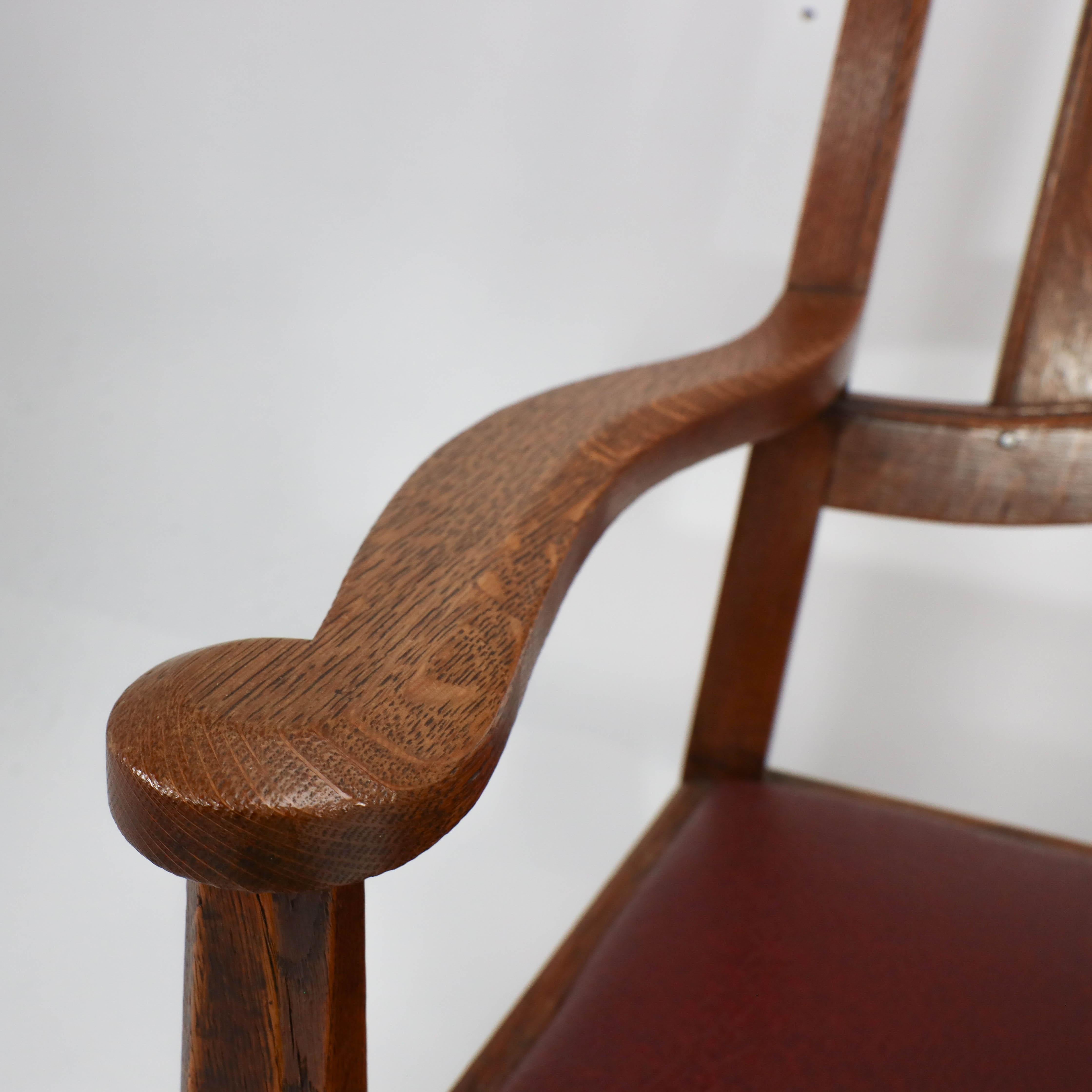 Late 19th Century W R Lethaby. A rare Arts & Crafts sculptured oak armchair with shaped arms For Sale