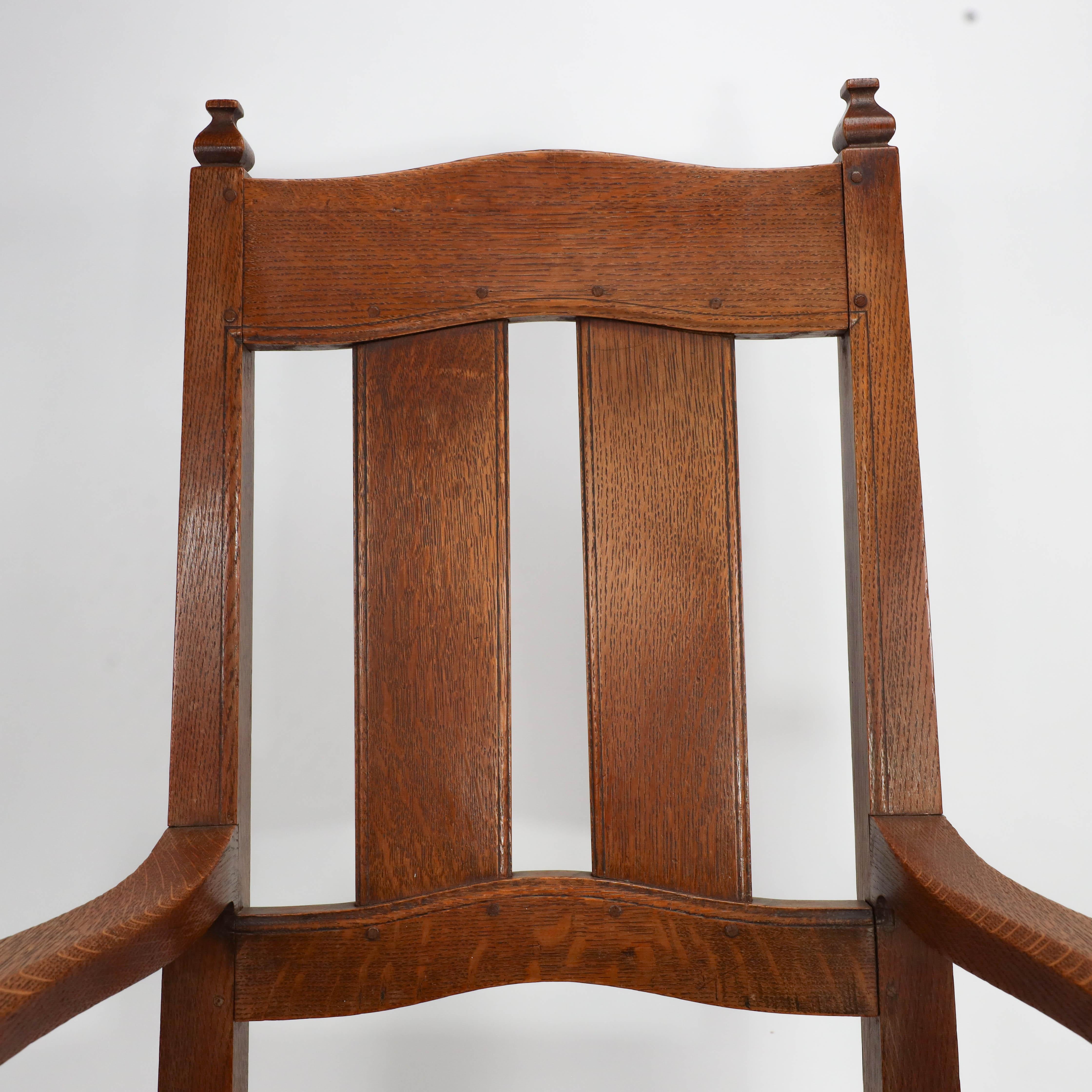 English W R Lethaby. A rare Arts & Crafts sculptured oak armchair with shaped arms For Sale