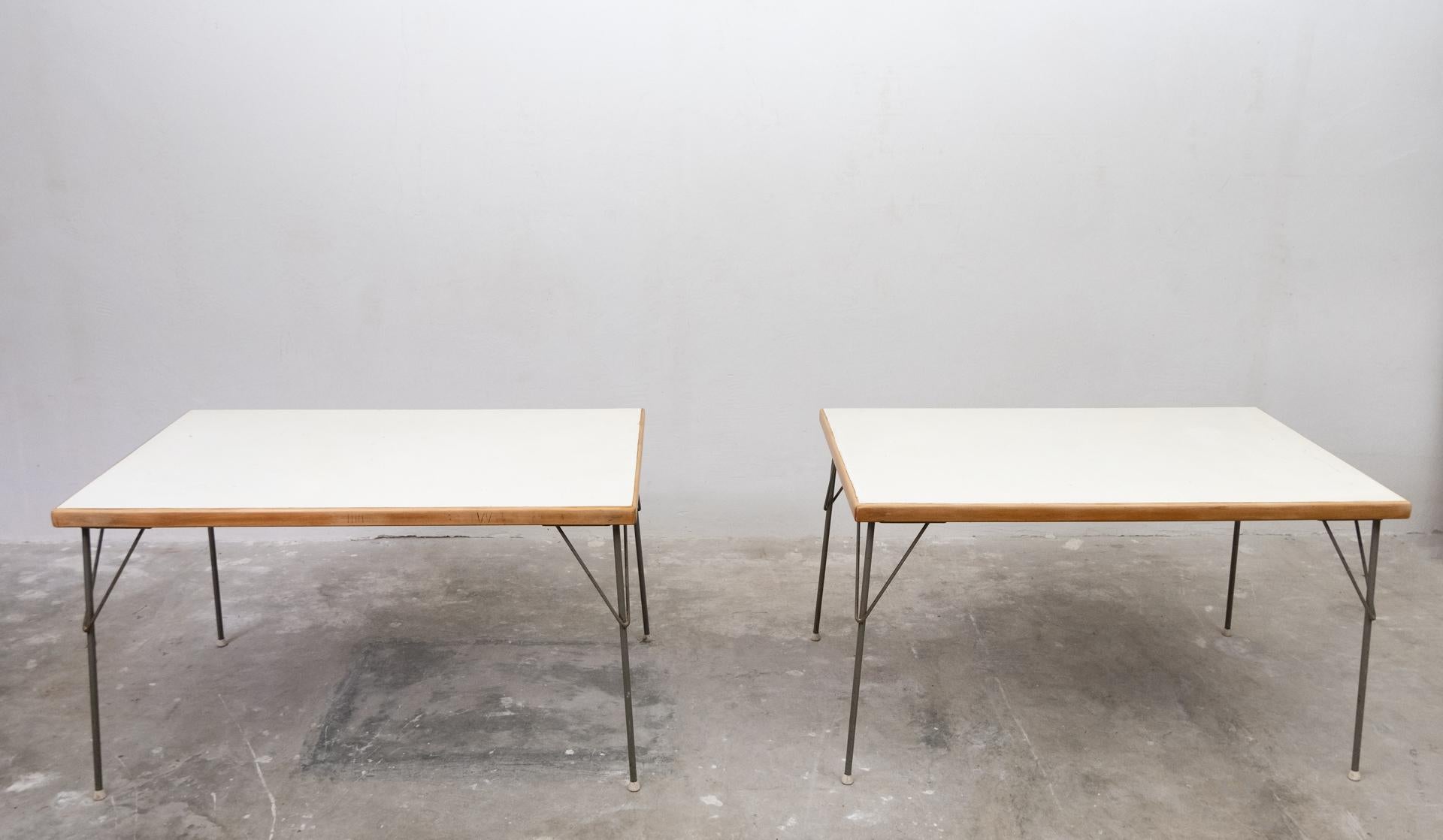 Two industrial dining tables model 531. Design by Wim Rietveld and André Cordemeyer for
Gispen Culenborg, 1954. Metal hairpin legs .Wooden rim and a melamine top. These are the larger
versions.
  