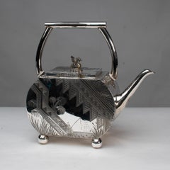 W W Harrison & Co. An Aesthetic Movement silver-plated tea pot