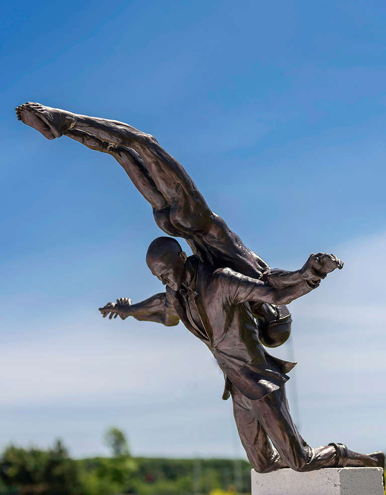 W.W. Hung Nude Sculpture - Deliverance 3/5 - tall, bronze, balancing, nude, male figure, outdoor sculpture