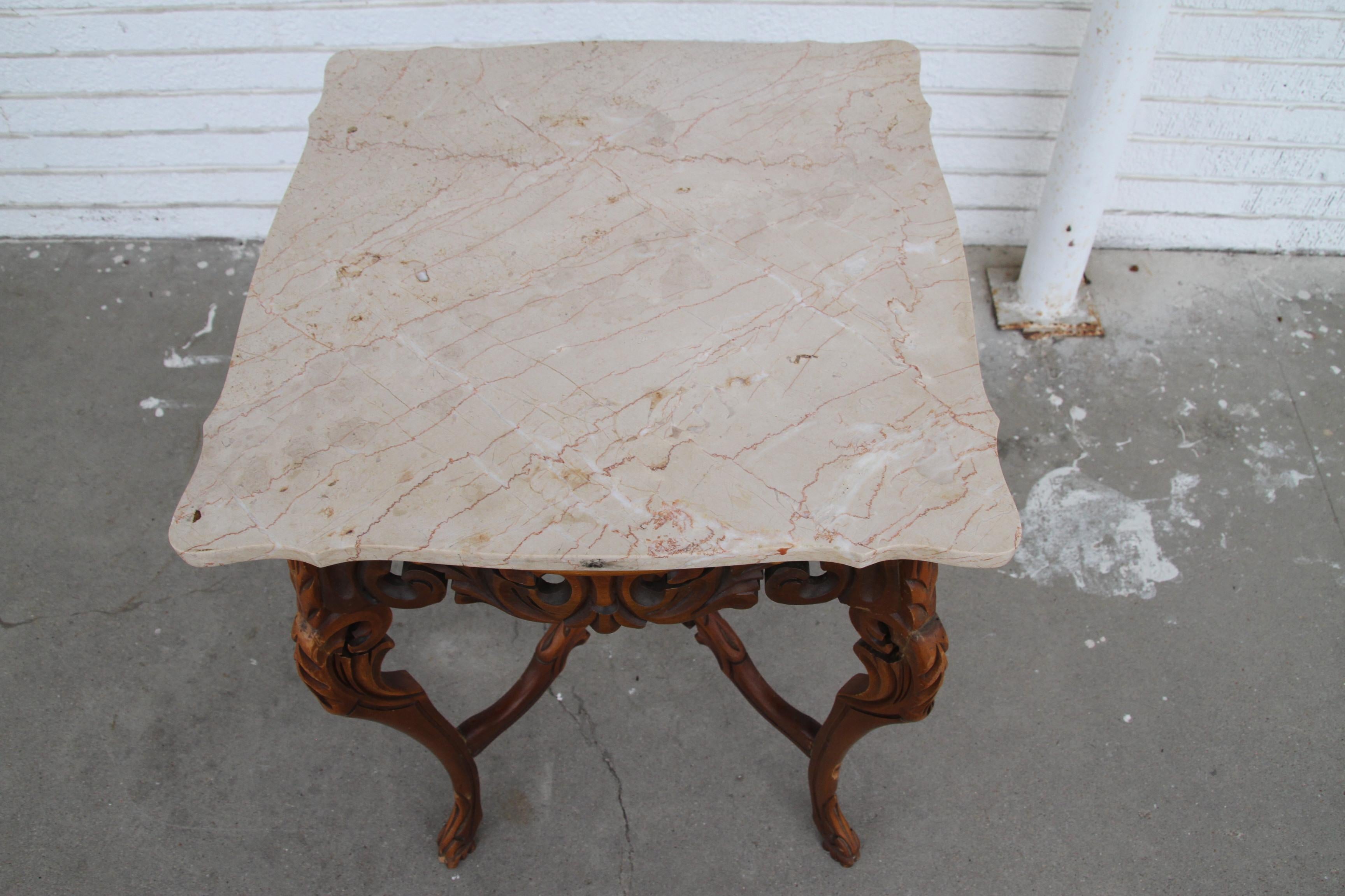 Rococco Style marble entry or side table 

Made by European based W & Z Furniture, this hand-carved side table features a beveled cream marble top. Makers mark. See measurements below.

Dimensions
 19 D x 19 W x 28 H.