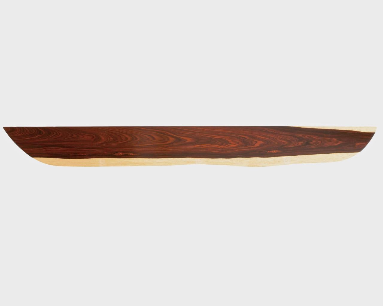 W0049 Wall Hanging Shelf in Cocobolo Wood by Jörg Pietschmann
Dimensions: D 20 x W 155 x H 2,5 cm.
Materials: Cocobolo wood.

In Pietschmann’s sculptures, trees that for centuries were part of a landscape and founded in primordial forces tell