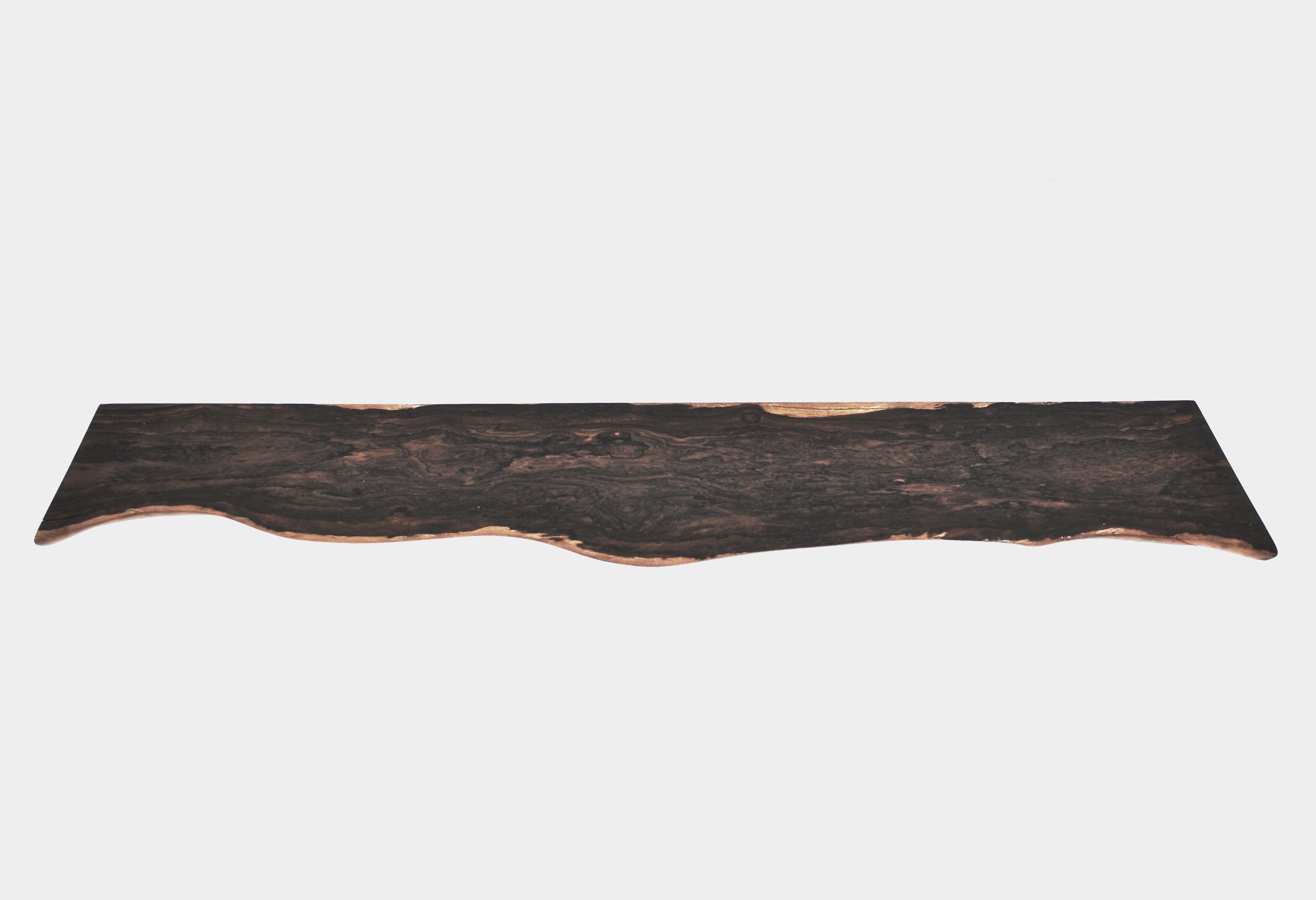 W1224 Wall Hanging Shelf in Zirikote Dark Wood by Jörg Pietschmann
Dimensions: D 22 x W 126 x H 2,5 cm.
Materials: Zirikote wood.

In Pietschmann’s sculptures, trees that for centuries were part of a landscape and founded in primordial forces tell