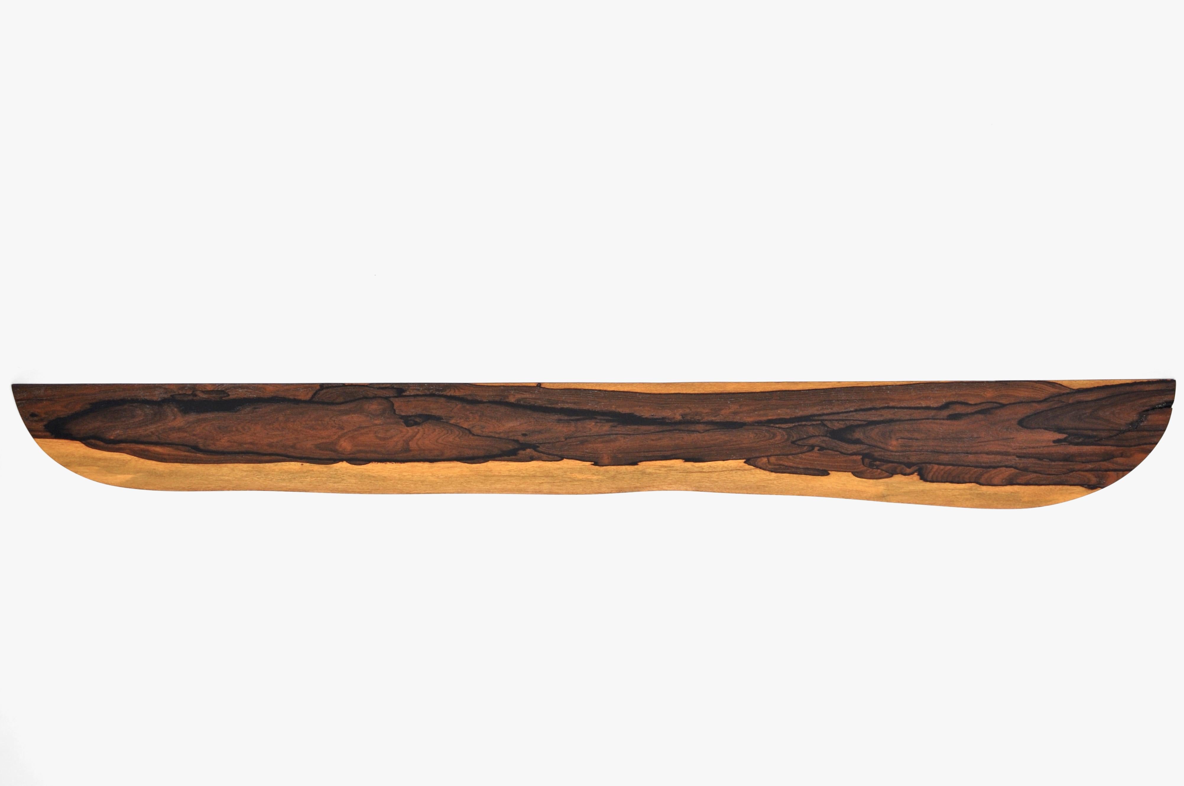 W1234 Wall Hanging Shelf in Zirikote Wood by Jörg Pietschmann
Dimensions: D 19,5 x W 178 x H 2,5 cm.
Materials: Zirikote wood.

In Pietschmann’s sculptures, trees that for centuries were part of a landscape and founded in primordial forces tell