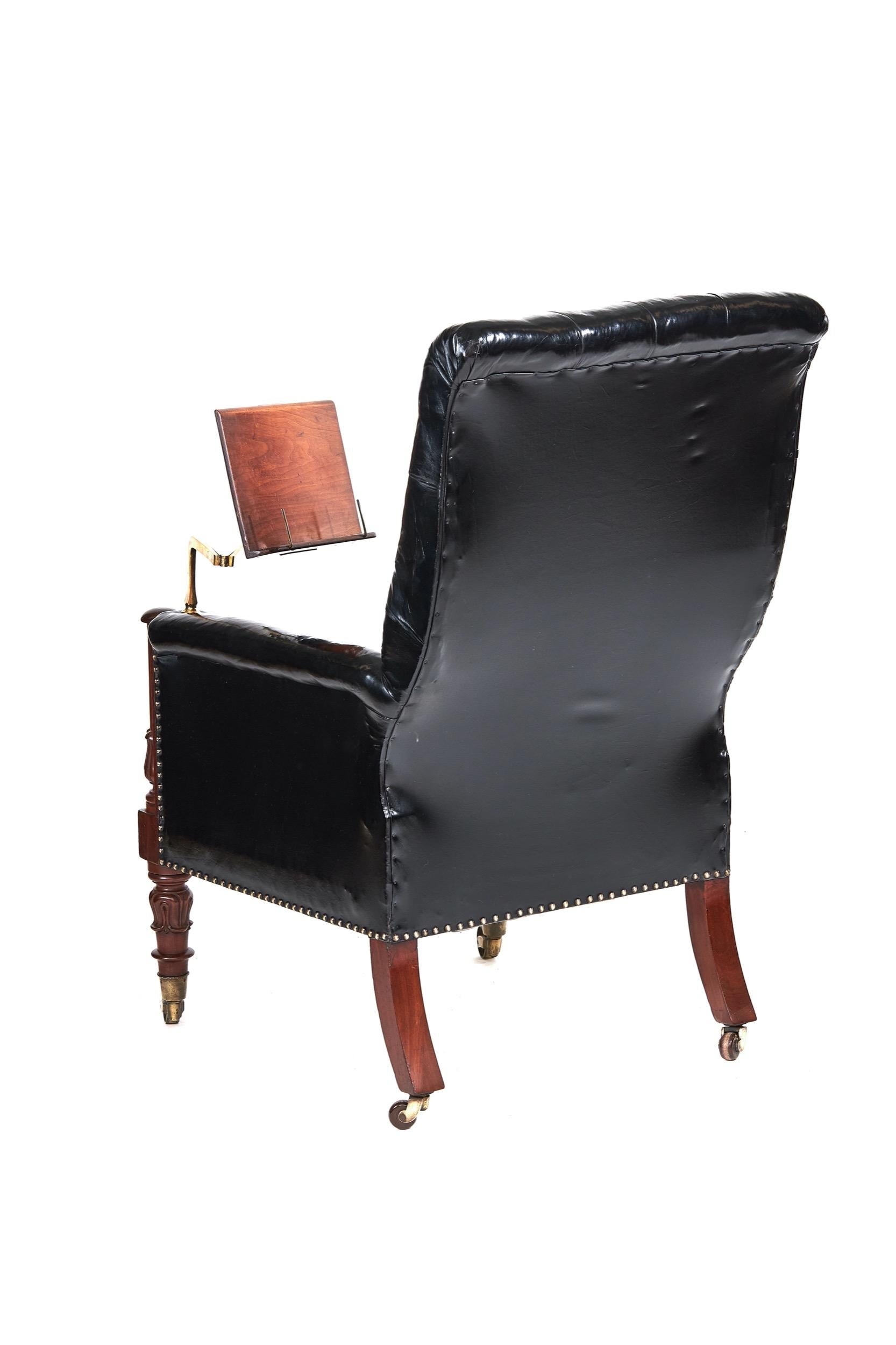 W1V Period Mahogany & leather library chair with Lectern
Deep Buttoned Black leather upholstery, 
Mahogany showframe front with:
Turned column & carved Tulip detail, 
with Pair Tulip carved & turned front legs, with brass cup castors
Lectern with