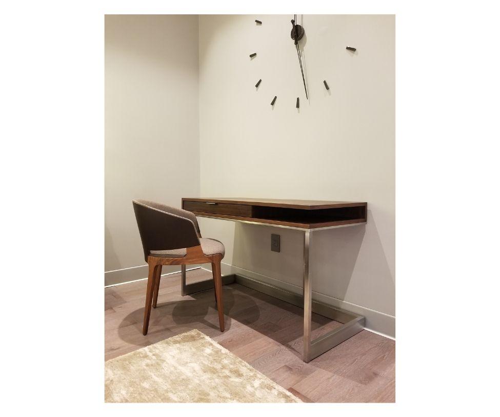 The W25 version of the wishbone drawer desk is an asymmetrical design. Features include book-matched veneer work with mitered, ‘waterfall’ edges, edges and corners protected with solid timber for added durability, and a single drawer in maple with