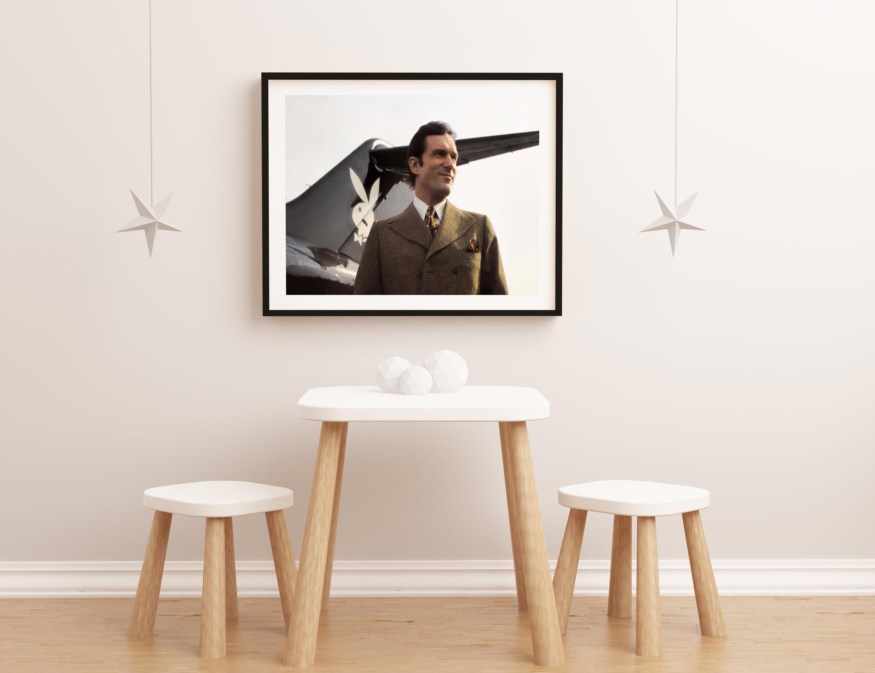 Hugh Hefner With His Playboy Jet Fine Art Print - Black Portrait Photograph by W.A. Greenslade