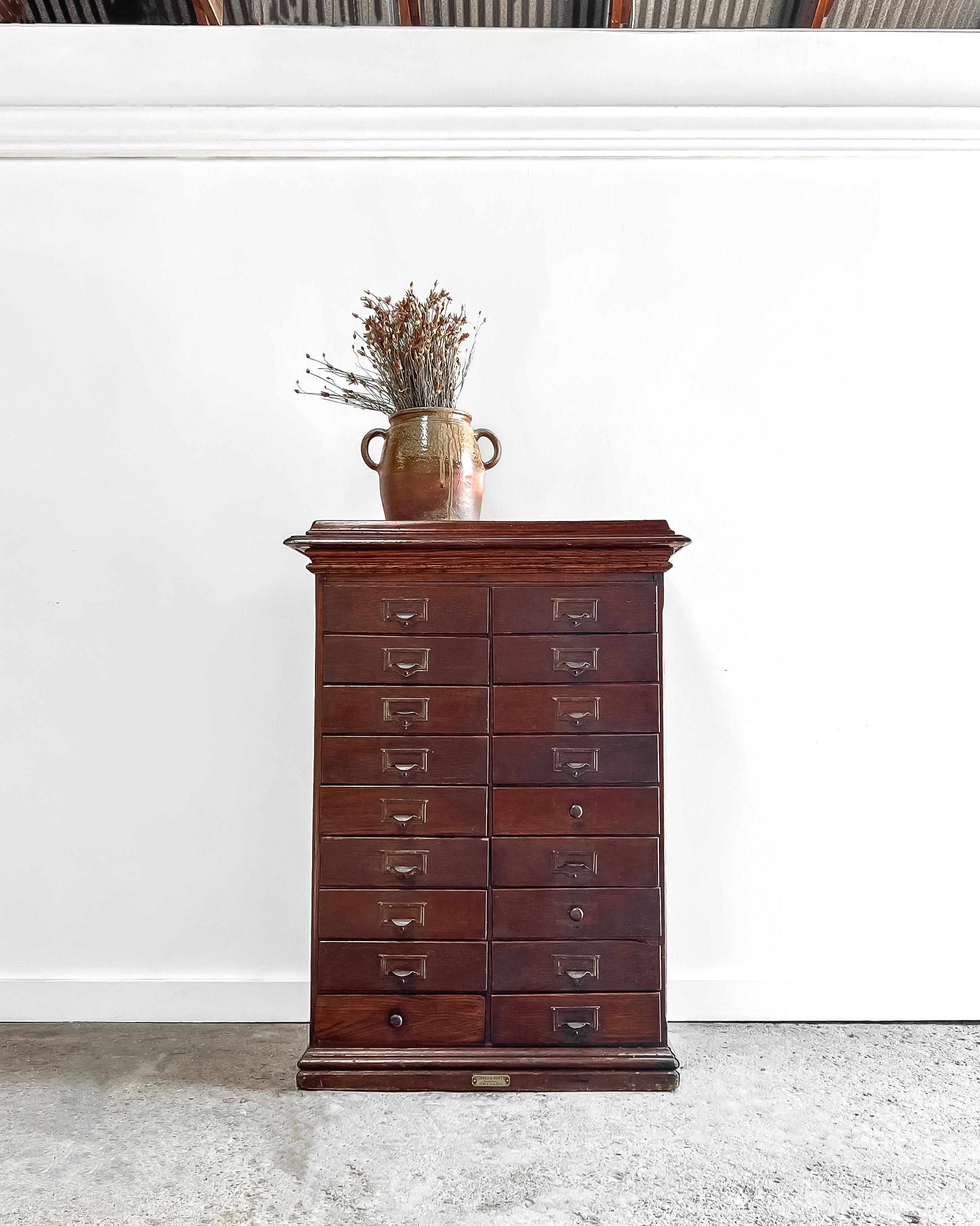A solid wood antique Craftsman period “Wabash Rival Letter File” cabinet. Constructed by the Rockwell & Rupel Manufacturers, Chicago, IL, the cabinet boasts 18 narrow drawers featuring brass label pull handles.

Each of the 18 drawers pulls out
