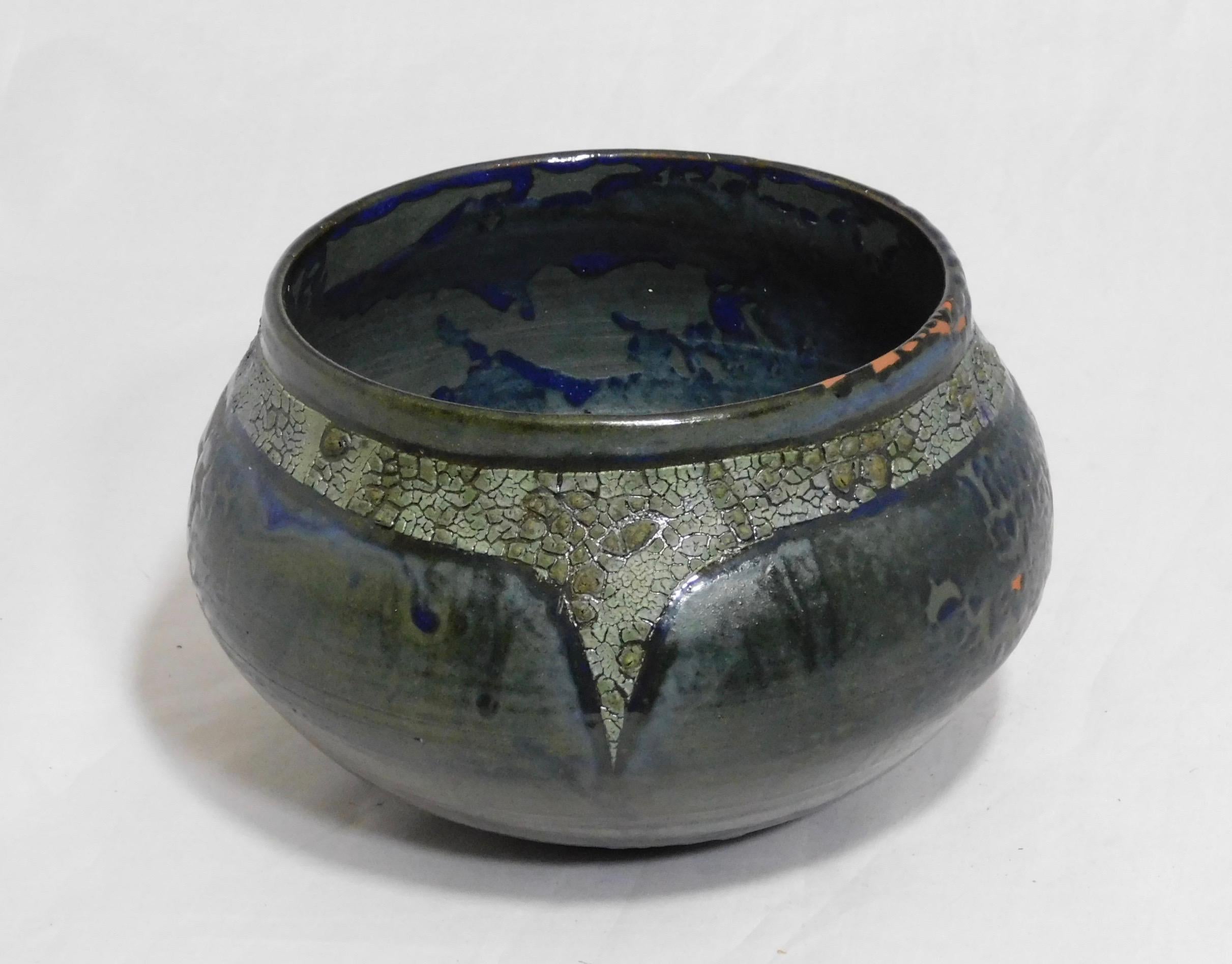 Wheel thrown Wabasso earthenware vessel by ceramicist Andrew Wilder. This is a one of a kind object made in the ancient way- by hand in a small artisanal pottery. In this series Wilder explores the application of lichen under glazes to achieve