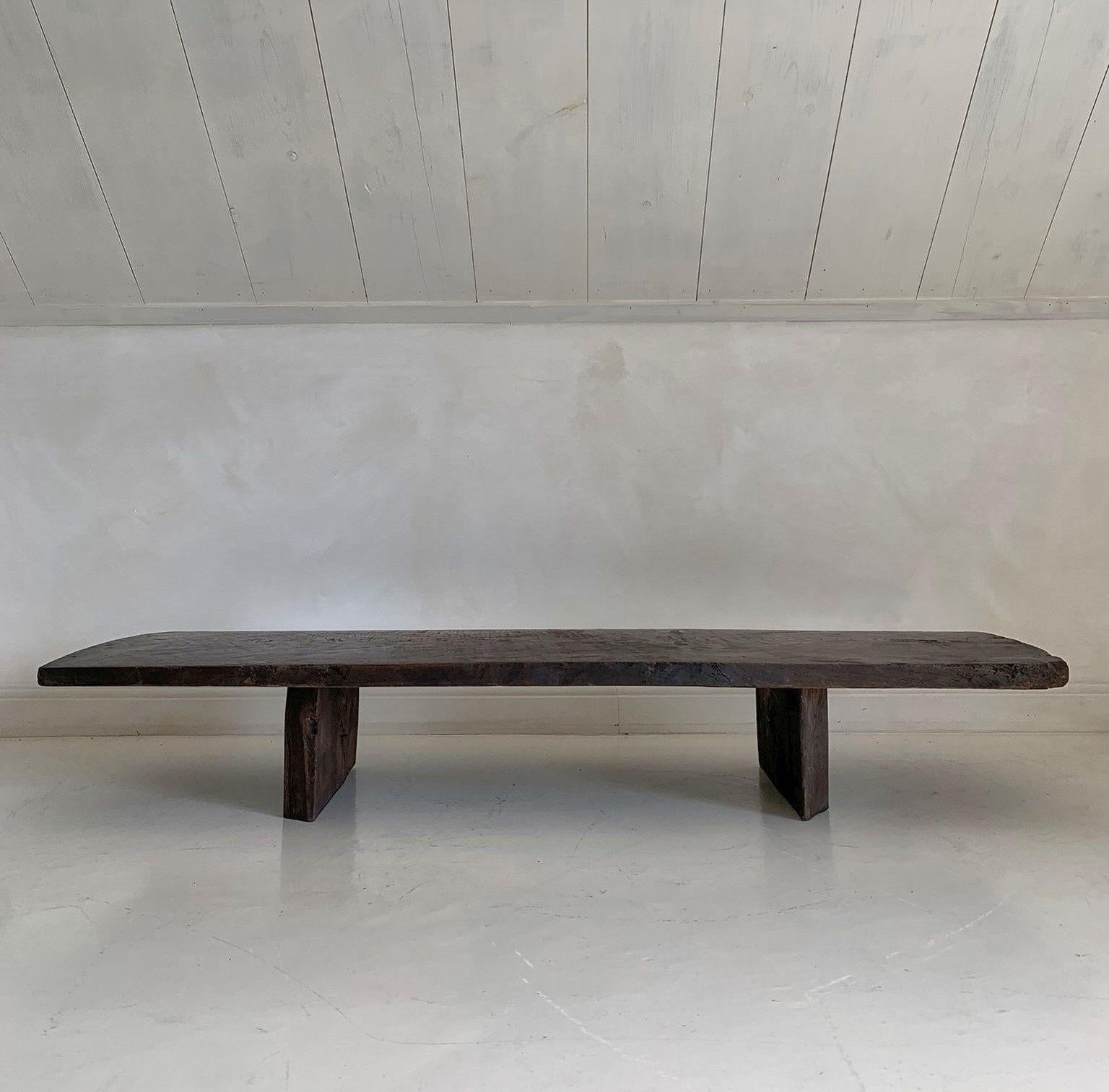 This coffeetable was made in our workshop starting from a one slab 19th century chestnut top from the Pyrinee region. The bases were made from reclaimed slabs of old oak.
