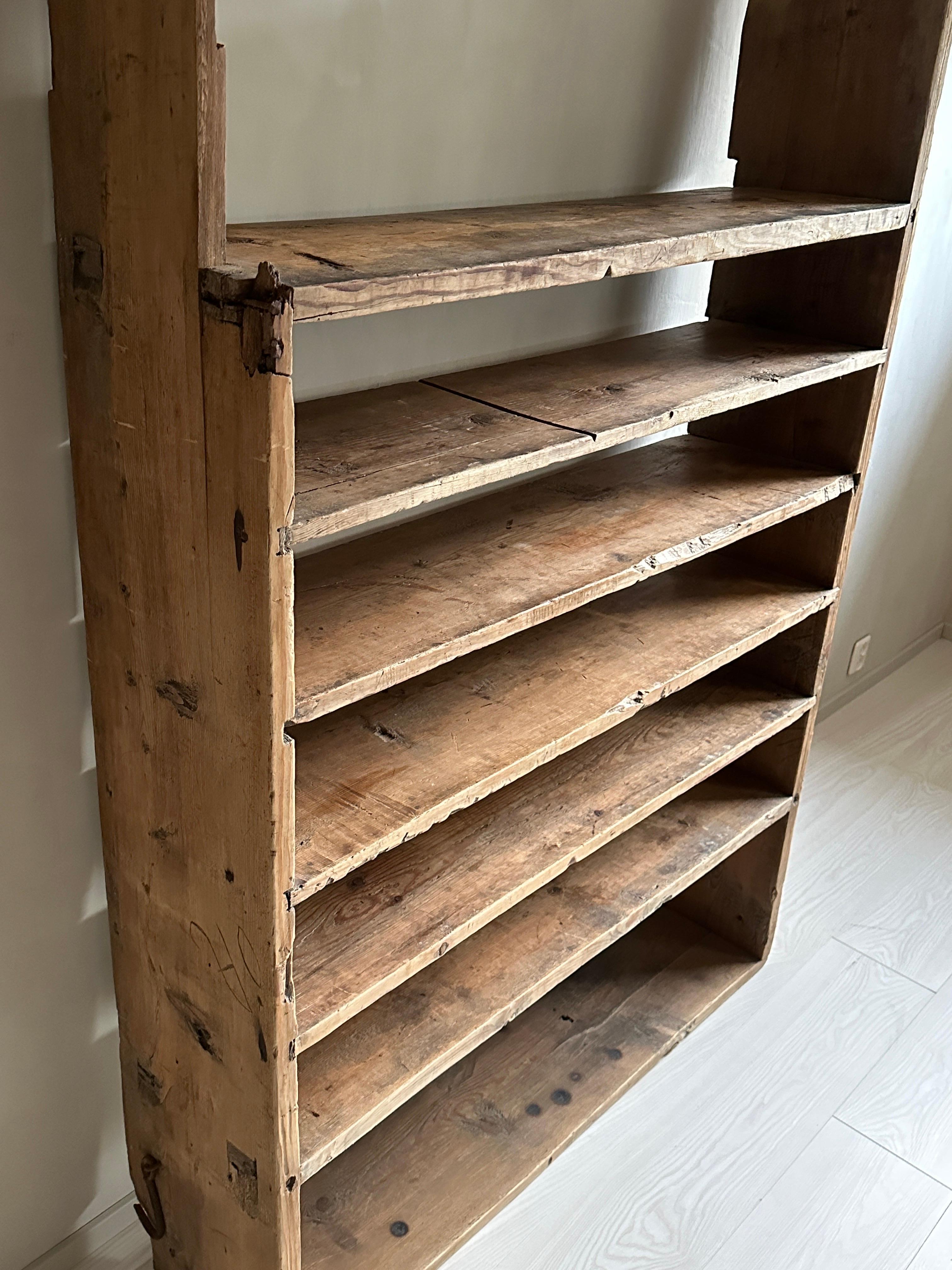 Beautiful antique book shelf in pine. Handcrafted by a Swedish cabinetmaker in late 1700s.

A great vintage book shelf with a lovely patina. A bit unsteady if standing alone, so should be attached to a wall

A unique rustic piece that fit in the