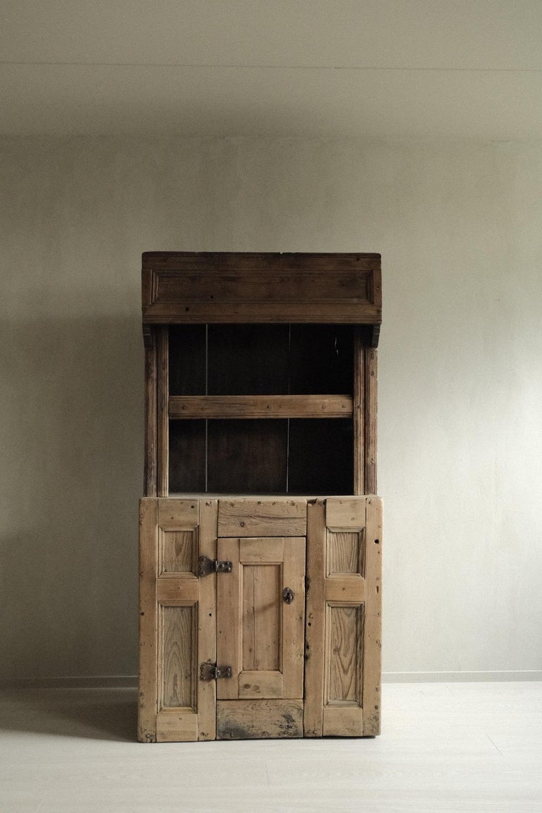 Beautiful antique cabinet in pine, made with wooden fittings. Handcrafted by a Swedish cabinetmaker in late 1700s.

A great vintage cupboard with a lovely patina. Original details like metal lock. Key included.

A unique rustic piece that fit in