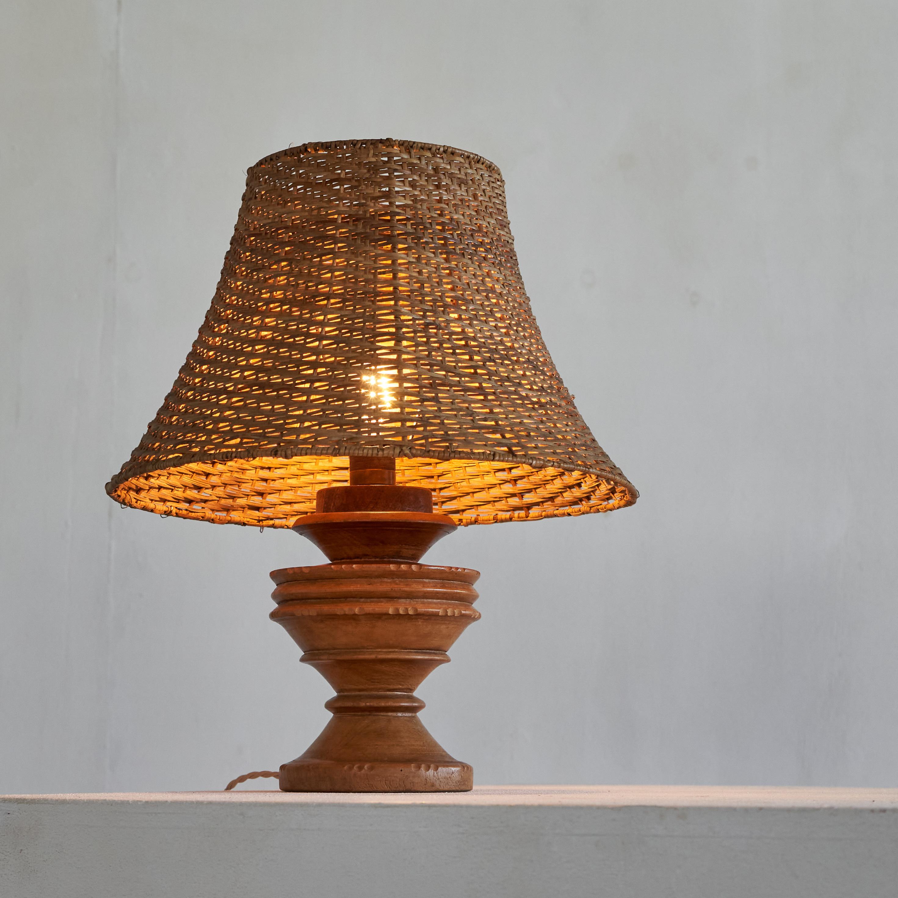 European Wabi Sabi Antique Table Lamp in Turned and Carved Wood with Rattan Shade For Sale