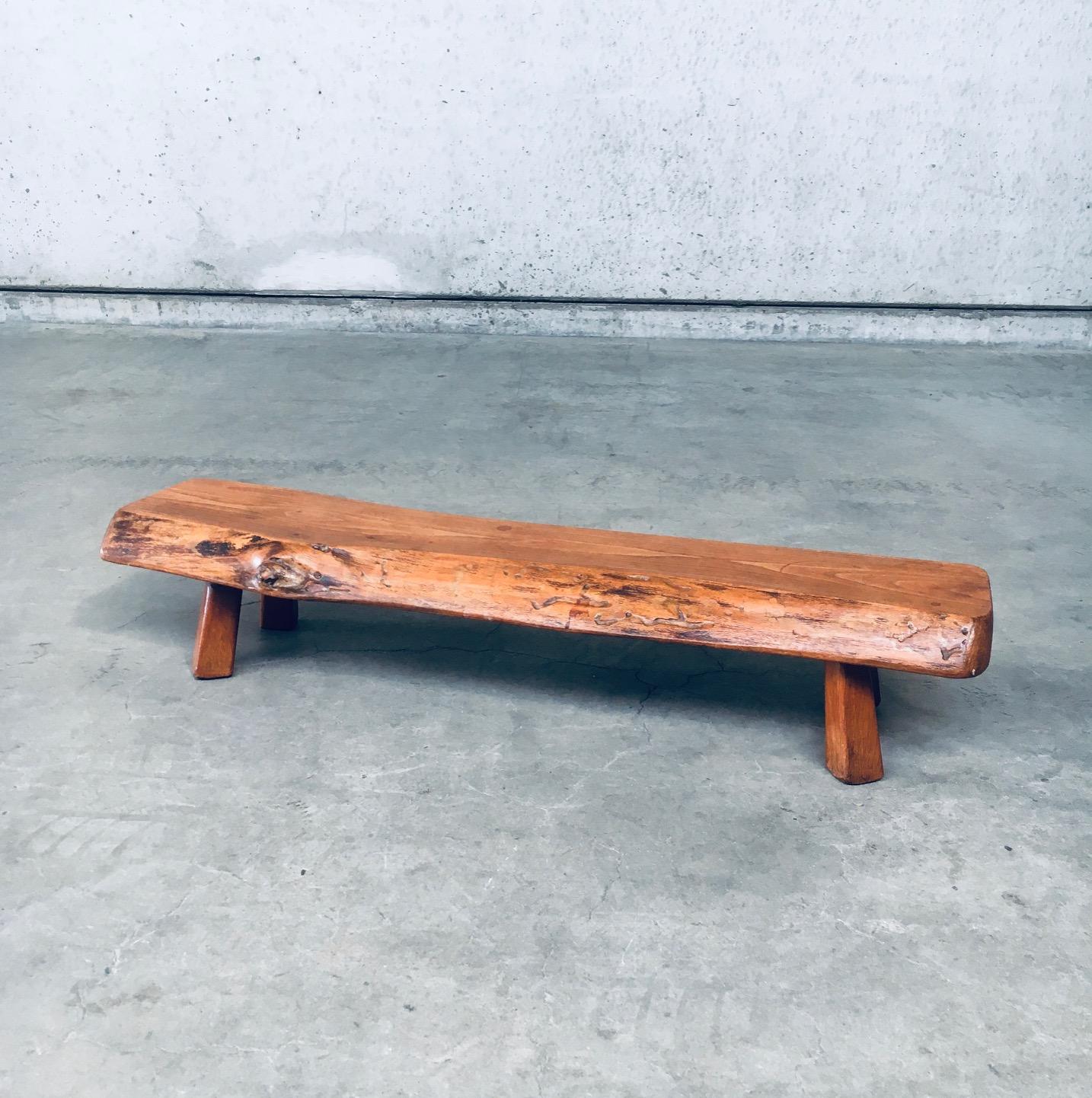 Wabi Sabi Brutalist Design Handcrafted Low Display Table. Made in Belgium by Atelier Andre Smalle, 1960's period. Stamped on the bottom. Solid oak slab on 4 square cone carved shaped feet. This can be used as a low plant or display side table. Comes
