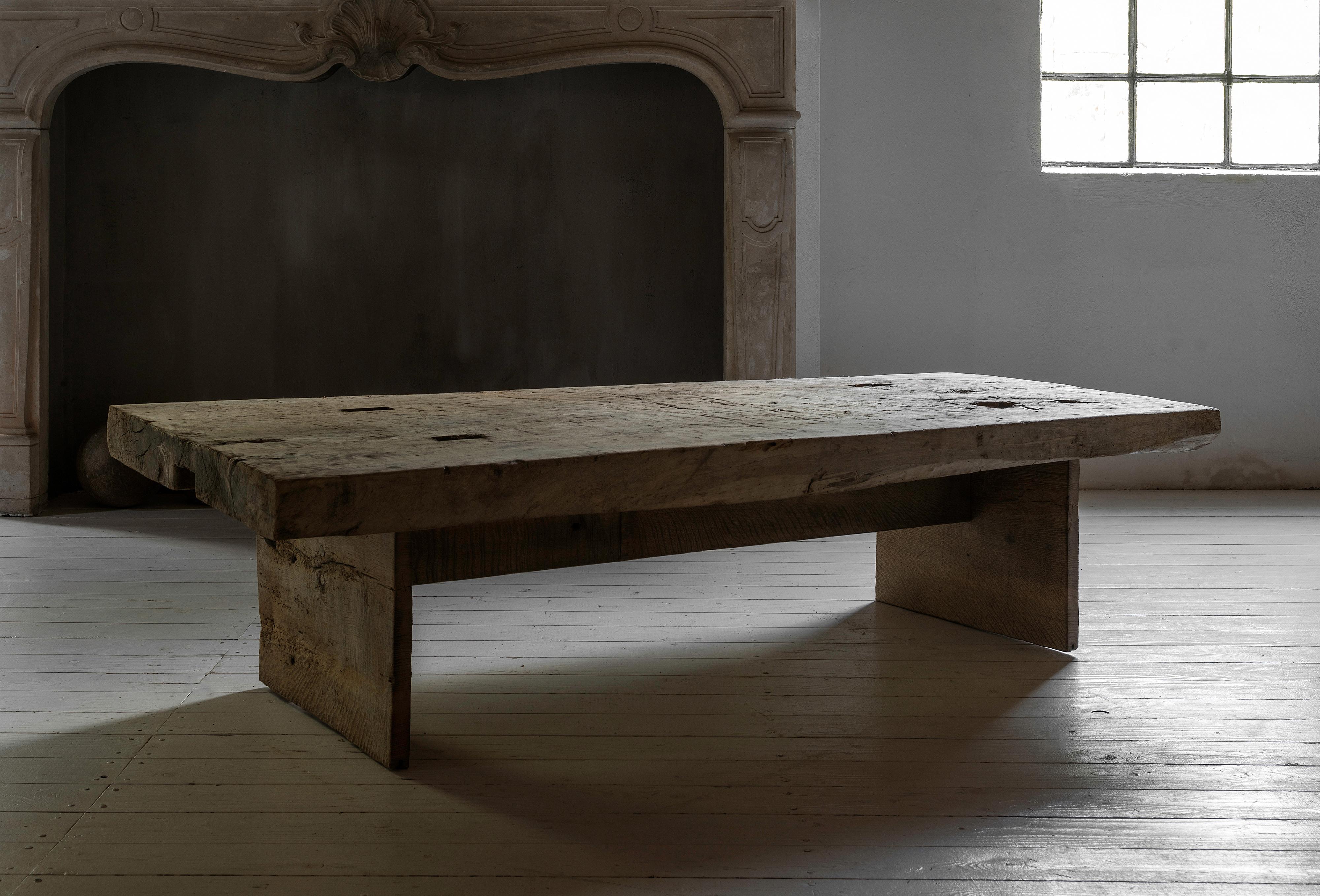 Wabi Sabi. A really rare chunky, beautifully weathered poplar table, 6 cm thick, dry grey patina, irreproduceable. 
Top made of 19th century rustic poplar, mounted on a solid and minimalist oak base.
A perfect coffee table, wether in a contemporary