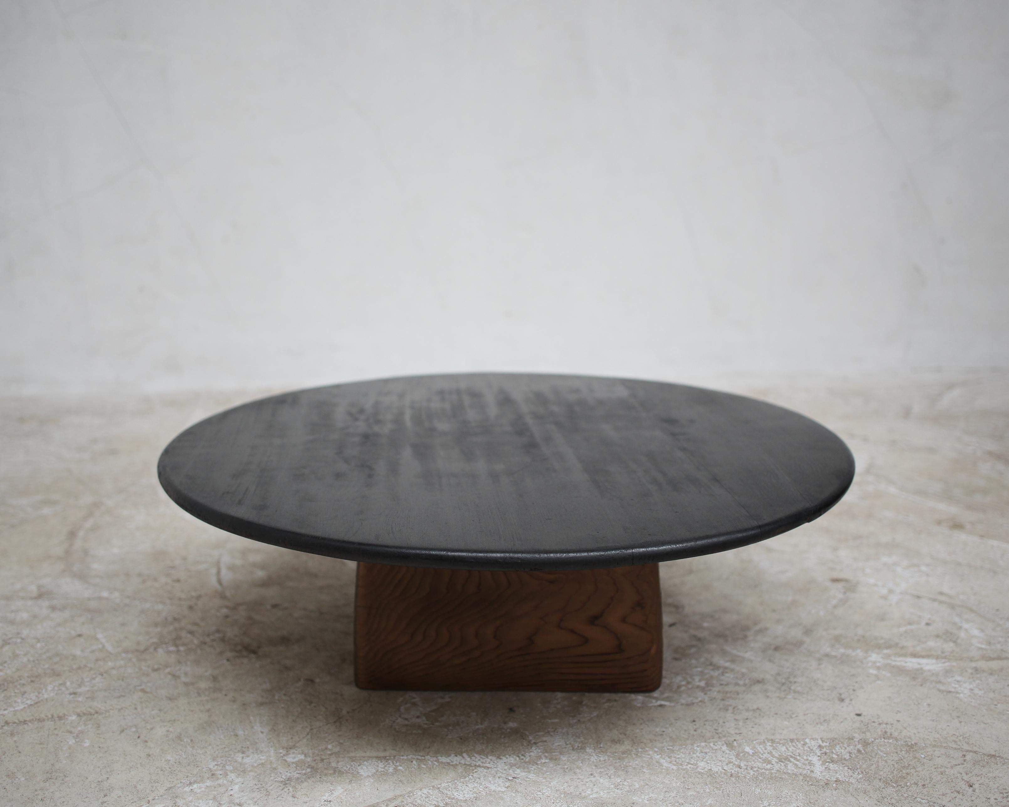 A unique circular charred cedar coffee table on weighted bleached-out cedar base.

Made using 19th century. Japanese elements in our London workshop.

-


