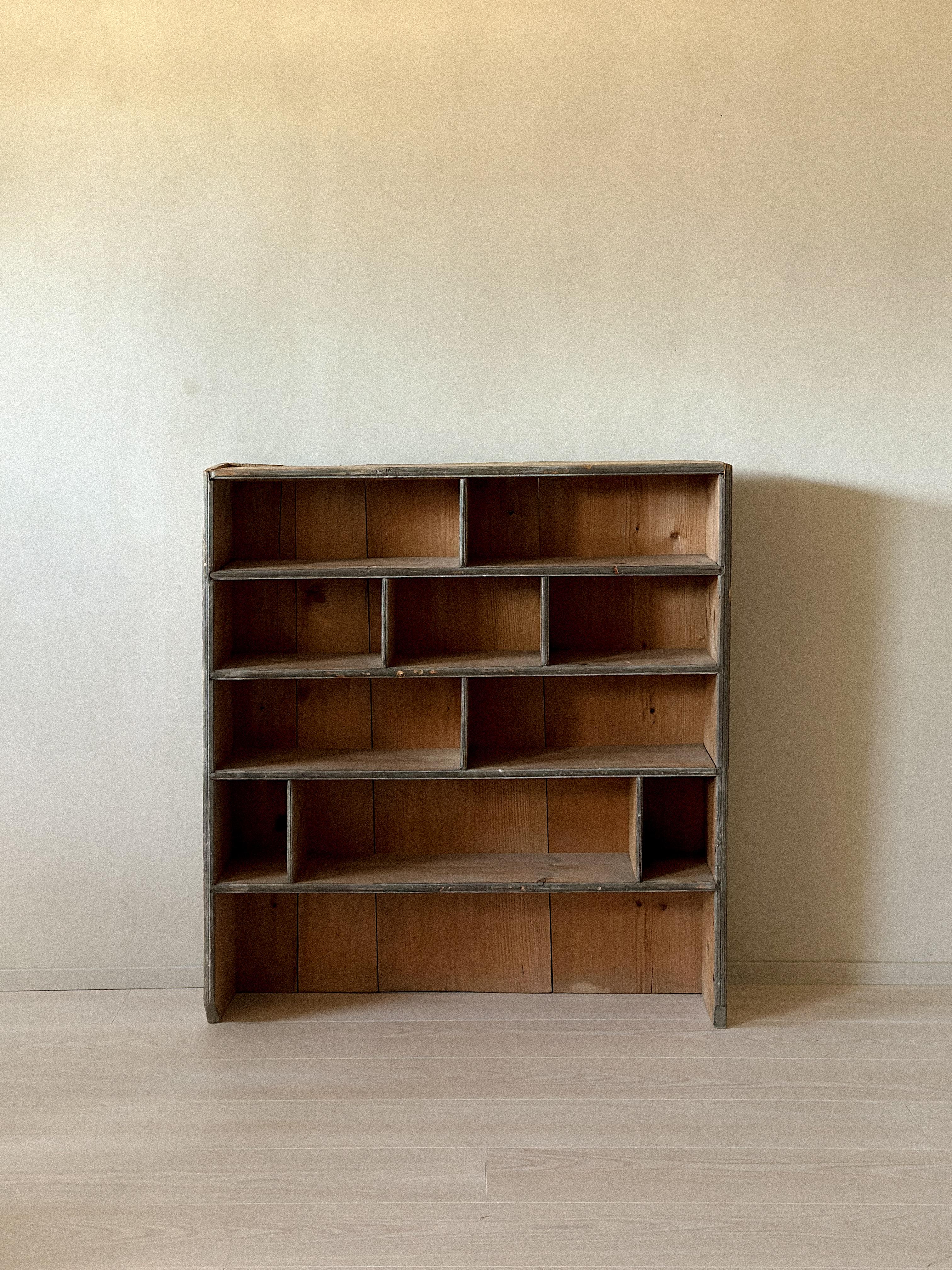 Wabi-sabi primitive bookshelf from Scandinavia, 1800s. Handcrafted with timeworn character and rich patina, celebrating the beauty of age and imperfection.