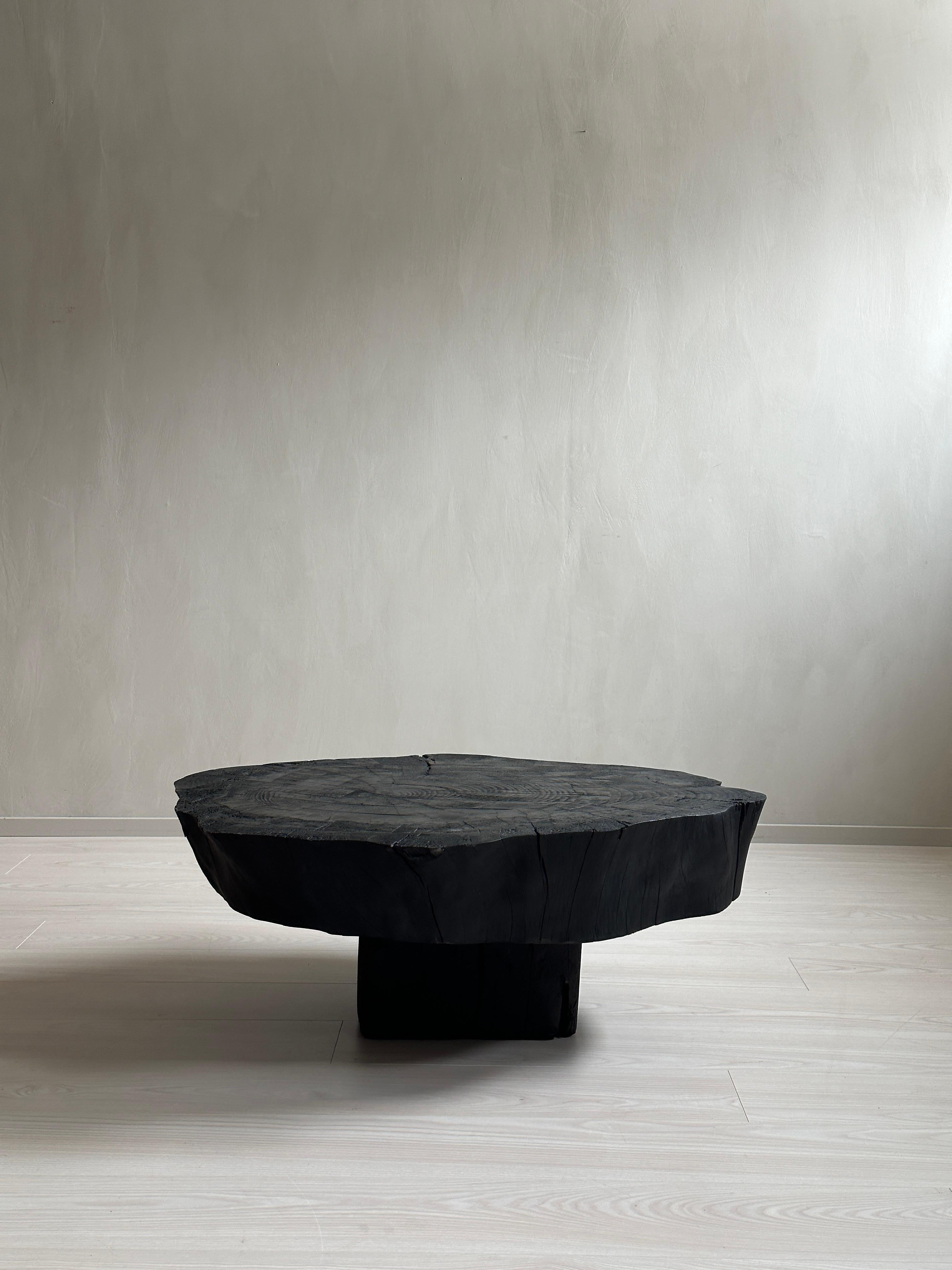 Introducing this stunning Brutalist coffee table, crafted in Spain in the 1970s and later Ebonized. This unique piece is designed in the Wabi Sabi style, featuring a beautifully distressed ebonized finish that adds to its rugged and organic