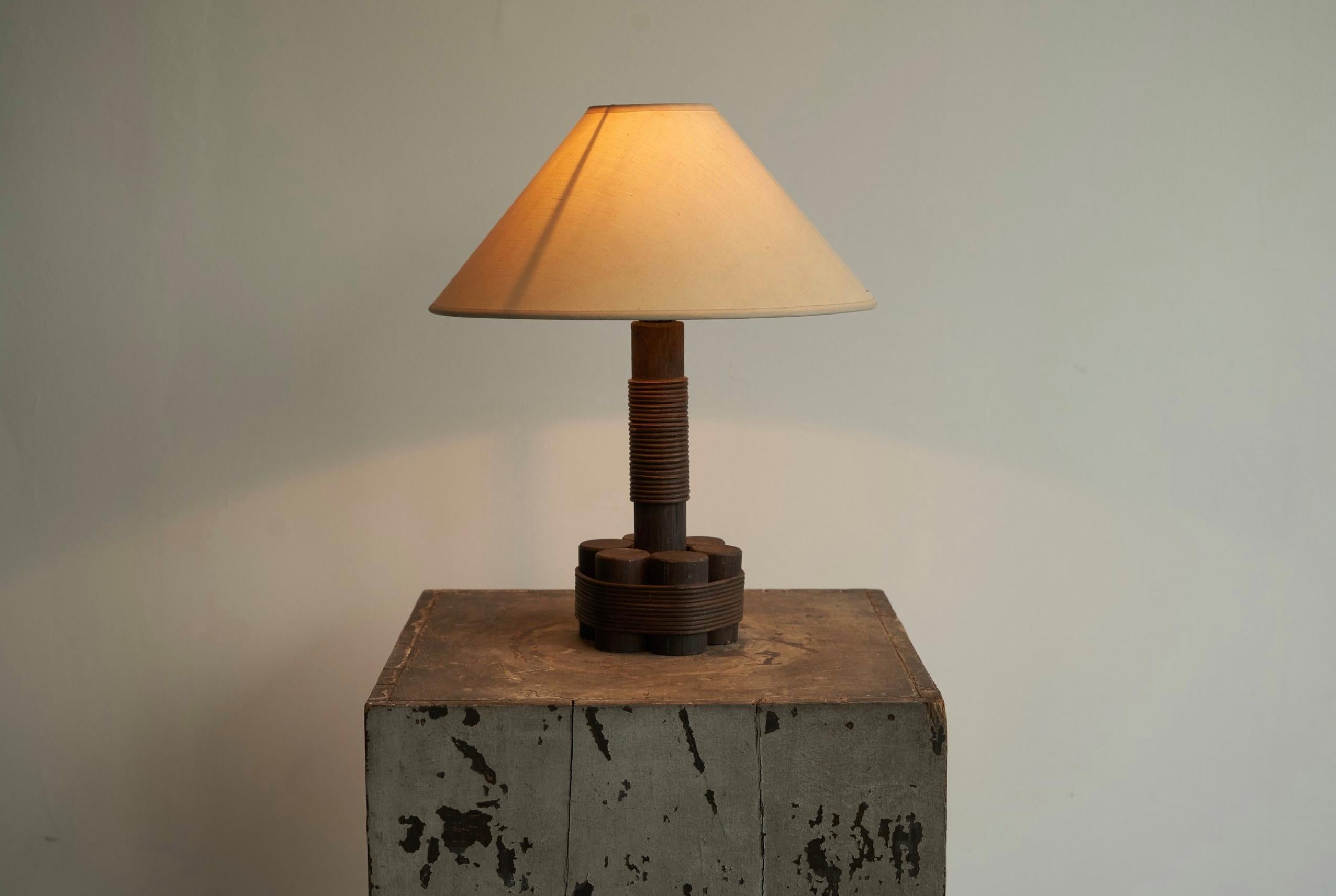 Table Lamp in Bamboo and Rattan 1970s.

Great and very atmospheric table lamp in bamboo and rattan, made somewhere in the 1970s. 

The lamp features a simple, but very sophisticated design with only a few pieces of bamboo which is being kept