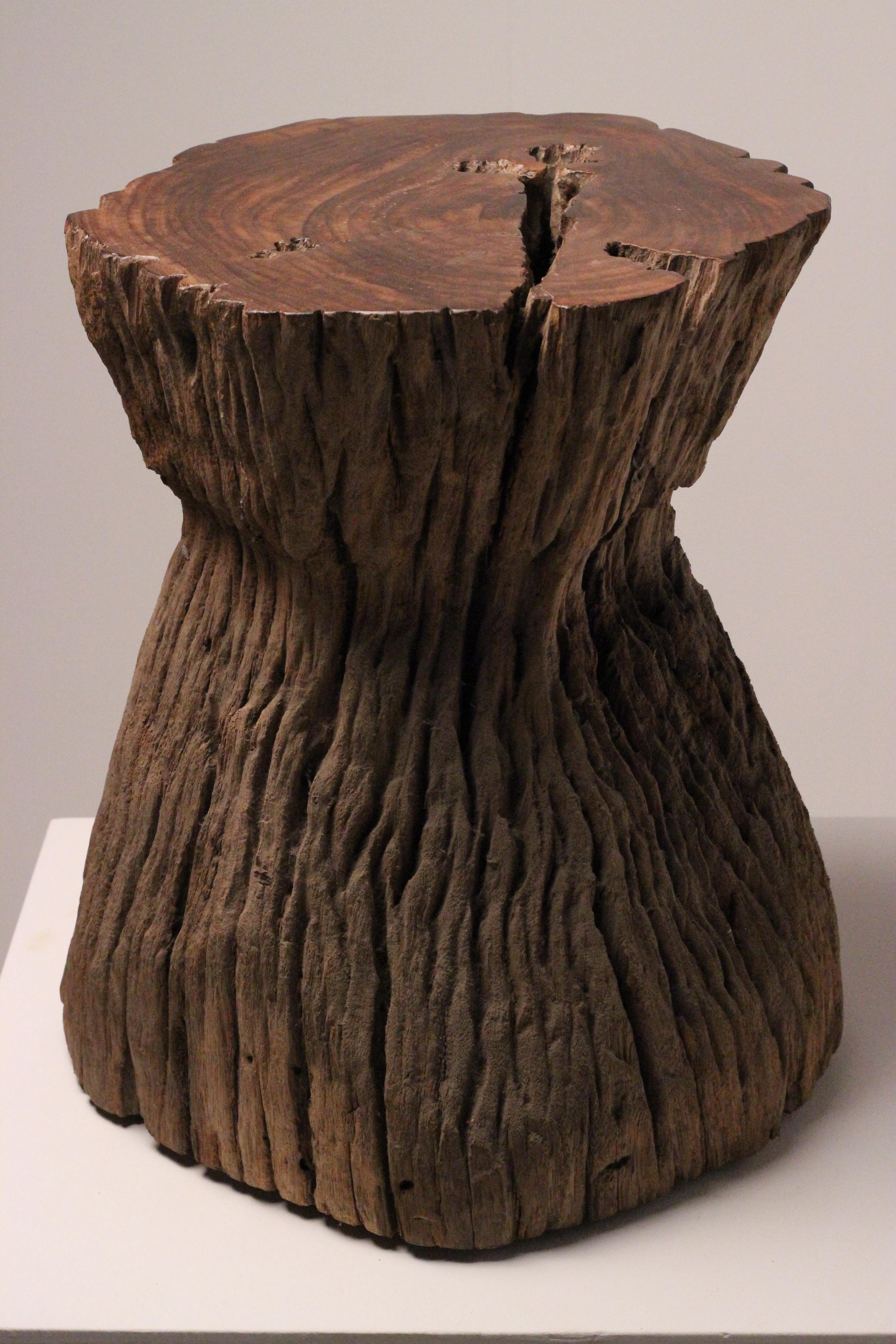 Wabi-Sabi Teak Root Stool or Side Table, Lombok Indonesia, 20th Century

This sculptural stool from Lombok, Indonesia, has been hand-carved from a single block of dense tropical hardwood, likely teak root. Its organic form features a broad top
