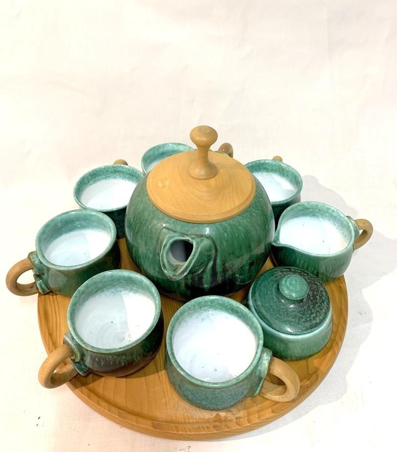 Unique handmade ceramic tea set by ceramicist designer Magdolna Kalmar. With wooden tray. Signed set. Possibly 1970s.