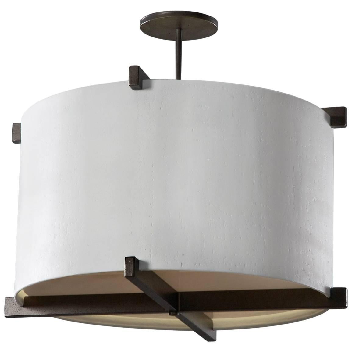Plaster of Paris shade inserted in a bronze patina frame
White plexiglass diffuser. The light provides a soft down light and a warm ambient light which reflects off the ceiling. Light uses two medium bulbs. Max wattage 200 watts. Chandelier is made