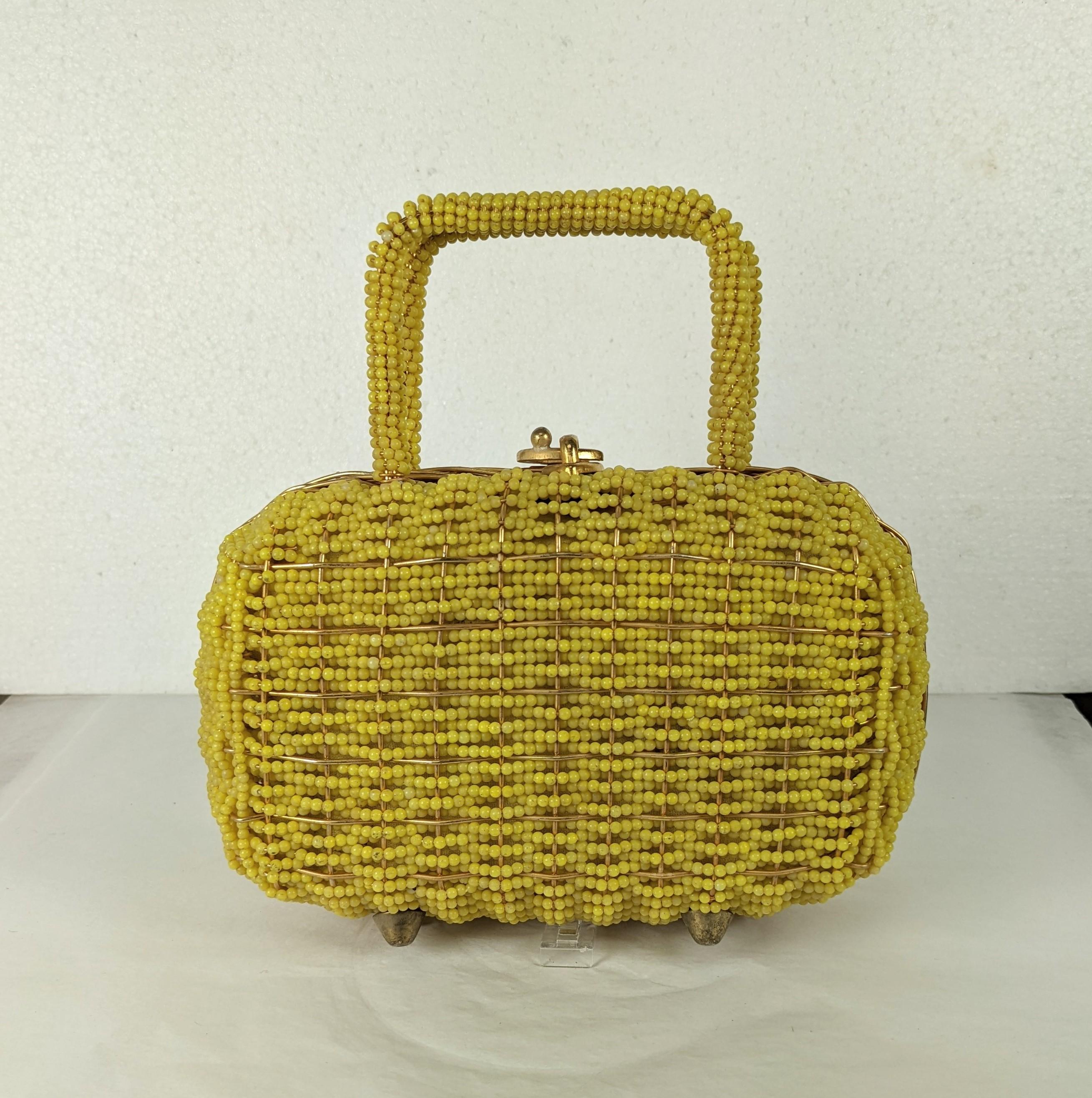 Walborg Beaded Top Handle Bag from the 1960's. Lined in gold metallic textile. Entire bag is hand beaded with yellow plastic beads on a hard wired frame with gilt latch on top. 1960's. 7