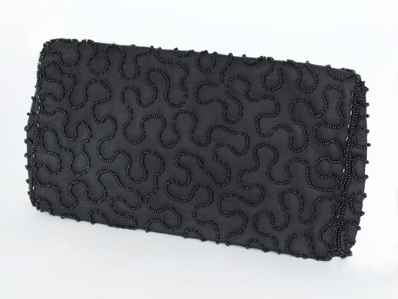 Lightweight and flexible, this beautiful evening bag is glamorous thanks to its scrolling beadwork but remains more understated than most Walborgs due to its matte black fabric ground. Never used, it is in mint condition and can't wait to be taken