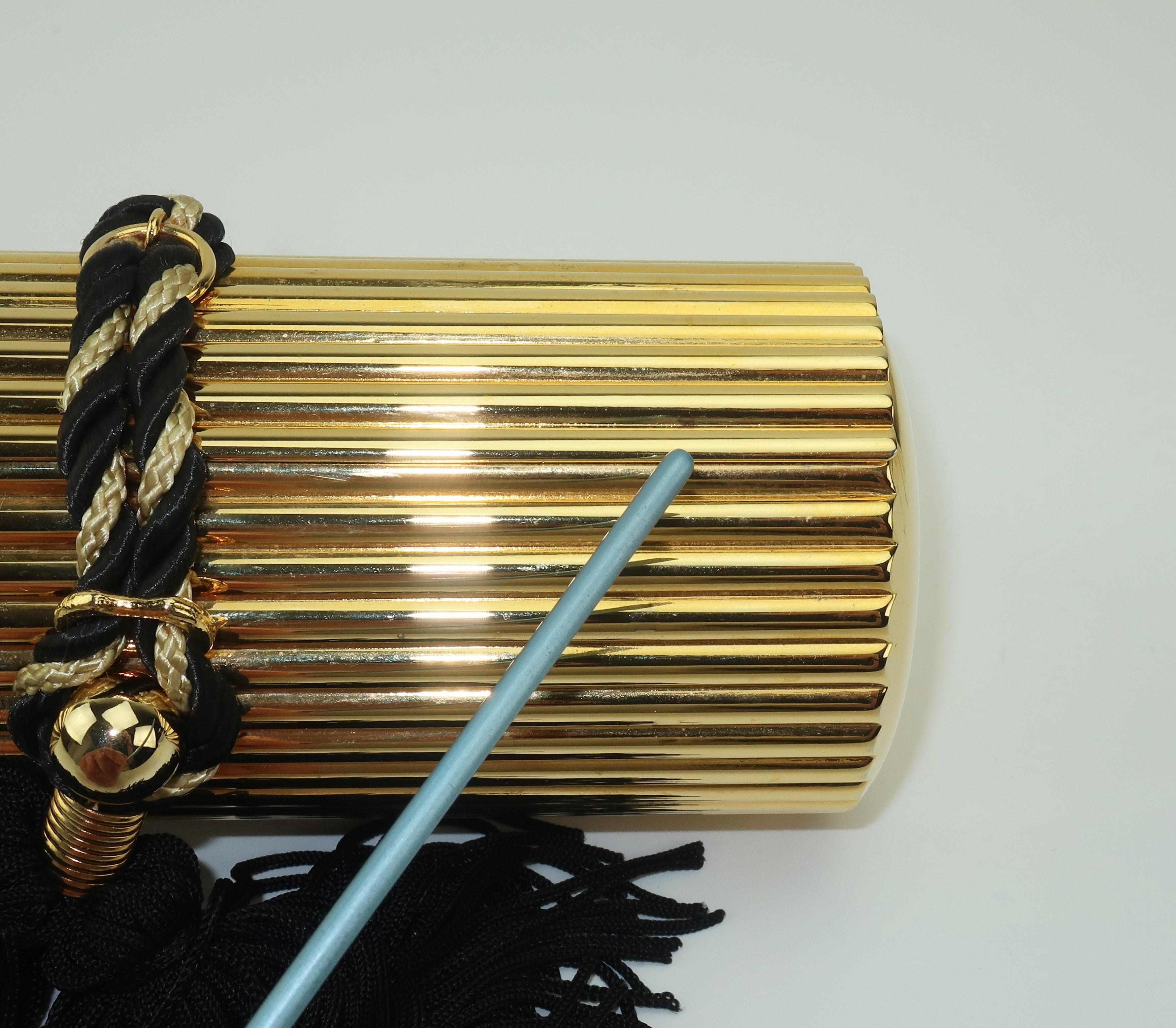 Walborg Gold Metal Cylinder Handbag With Black Tassel Closure 2