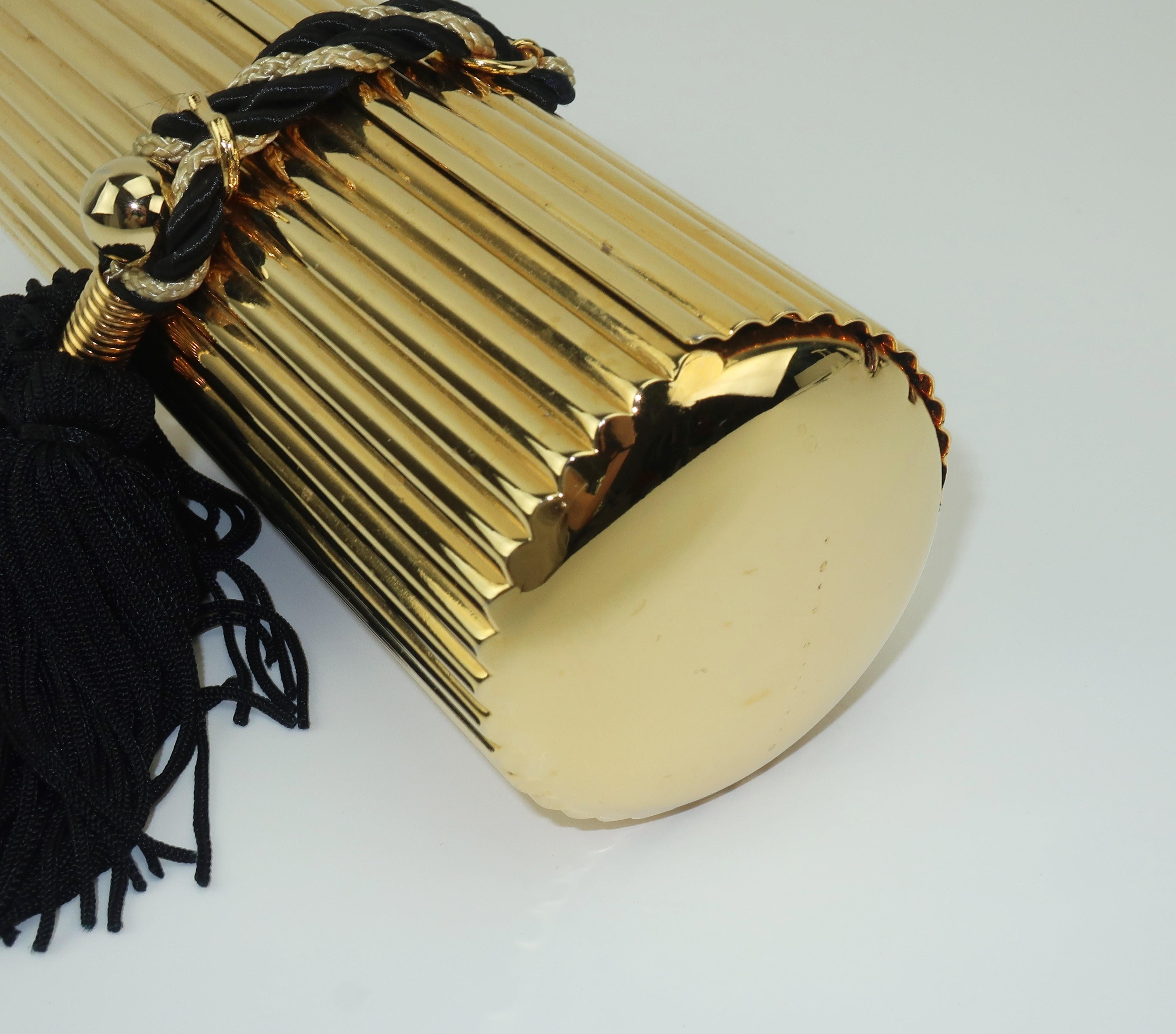 Walborg Gold Metal Cylinder Handbag With Black Tassel Closure 4