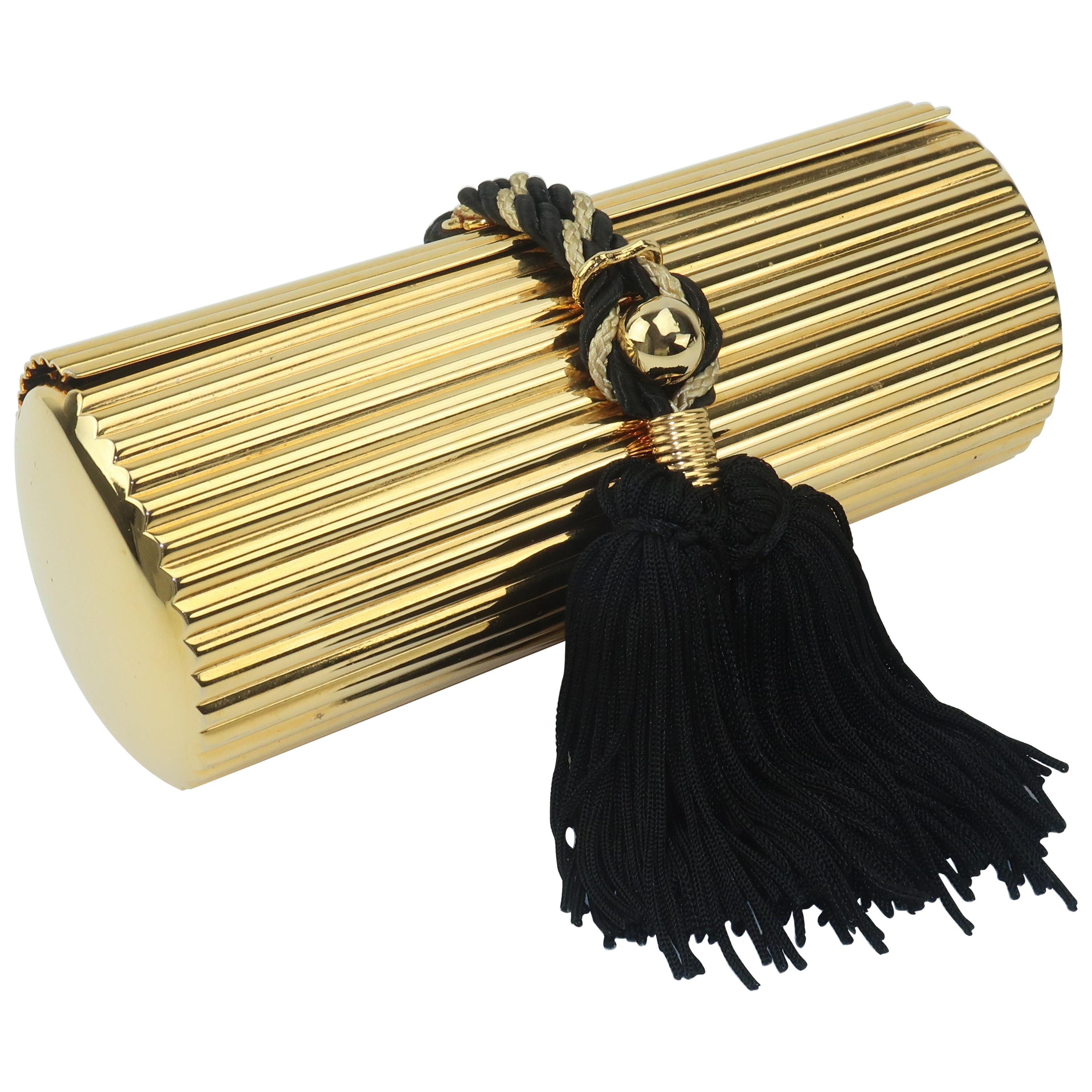 Walborg Gold Metal Cylinder Handbag With Black Tassel Closure at 1stDibs