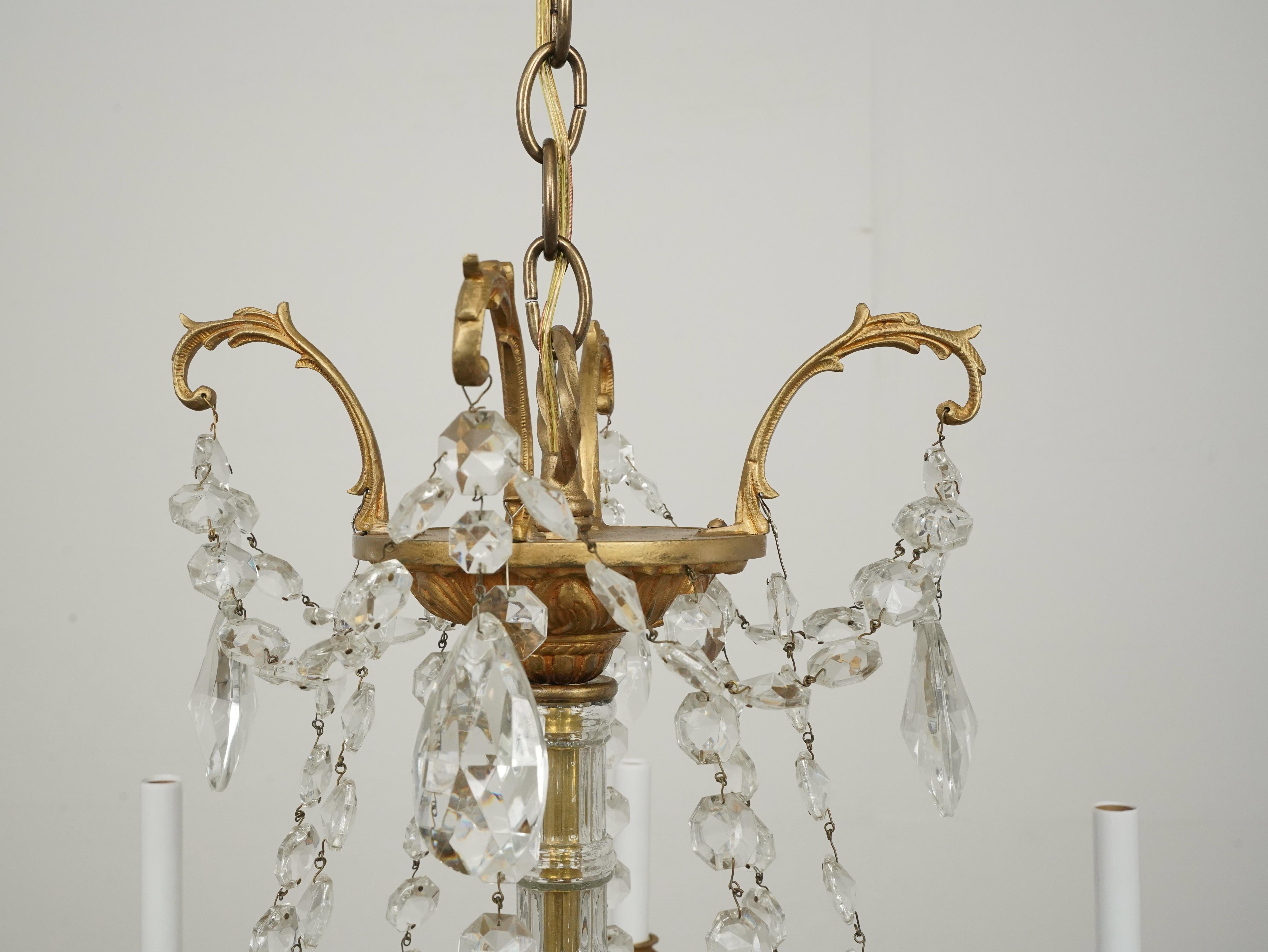20th Century Waldorf Astoria 8 Arm Crystal Beaded & Brass Chandelier For Sale