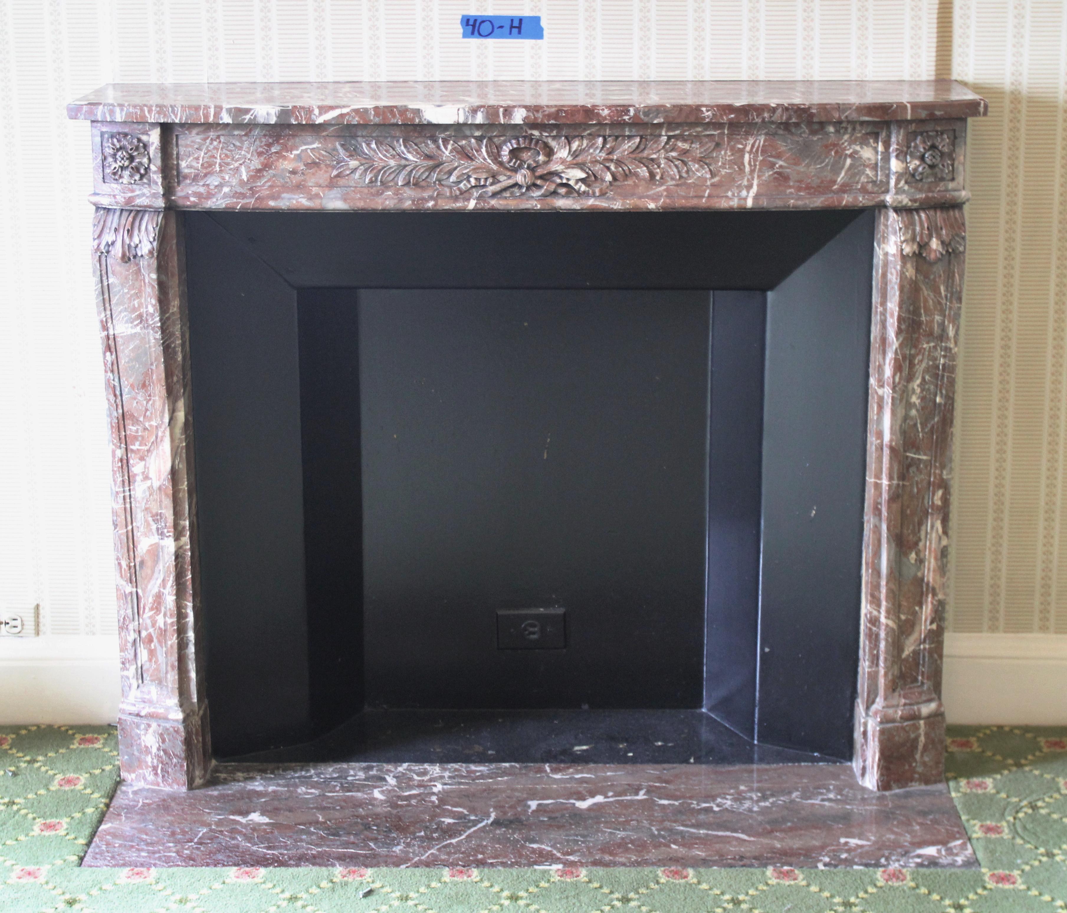 Hearth not available.
Exquisite Louis XVI Regency carved marble mantel, exuding timeless elegance. Originally imported from France, this magnificent mantel was destined for the Waldorf Astoria Hotel and became a part of its allure circa 1930. Its