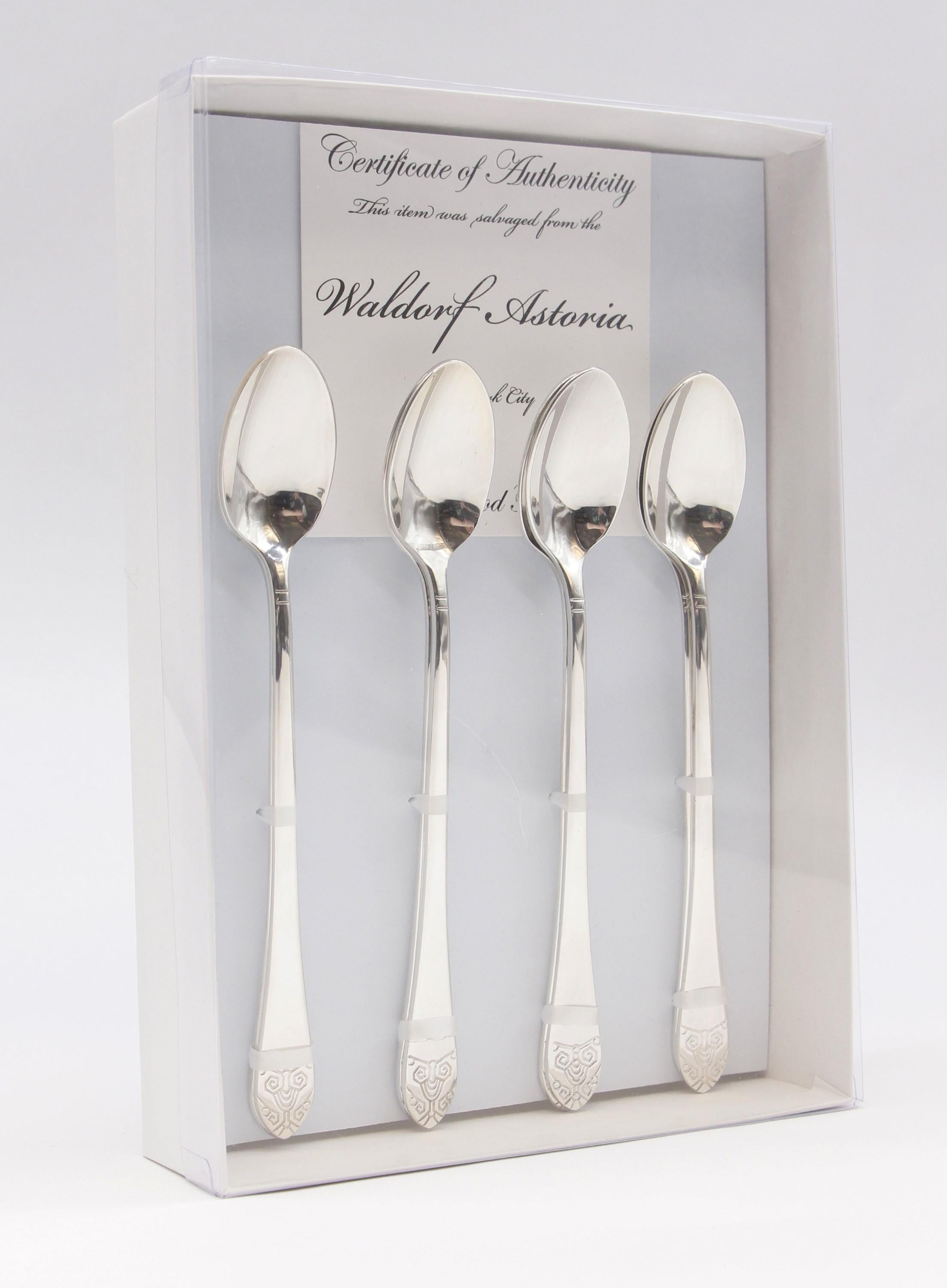 New, never used 8 piece silver plated steel Art Deco style ice teaspoon flatware set featuring the famous Waldorf Astoria Hotel logo. Made by Oneida. These pieces were back stock in the Waldorf Astoria Hotel on Park Ave in New York City. All pieces