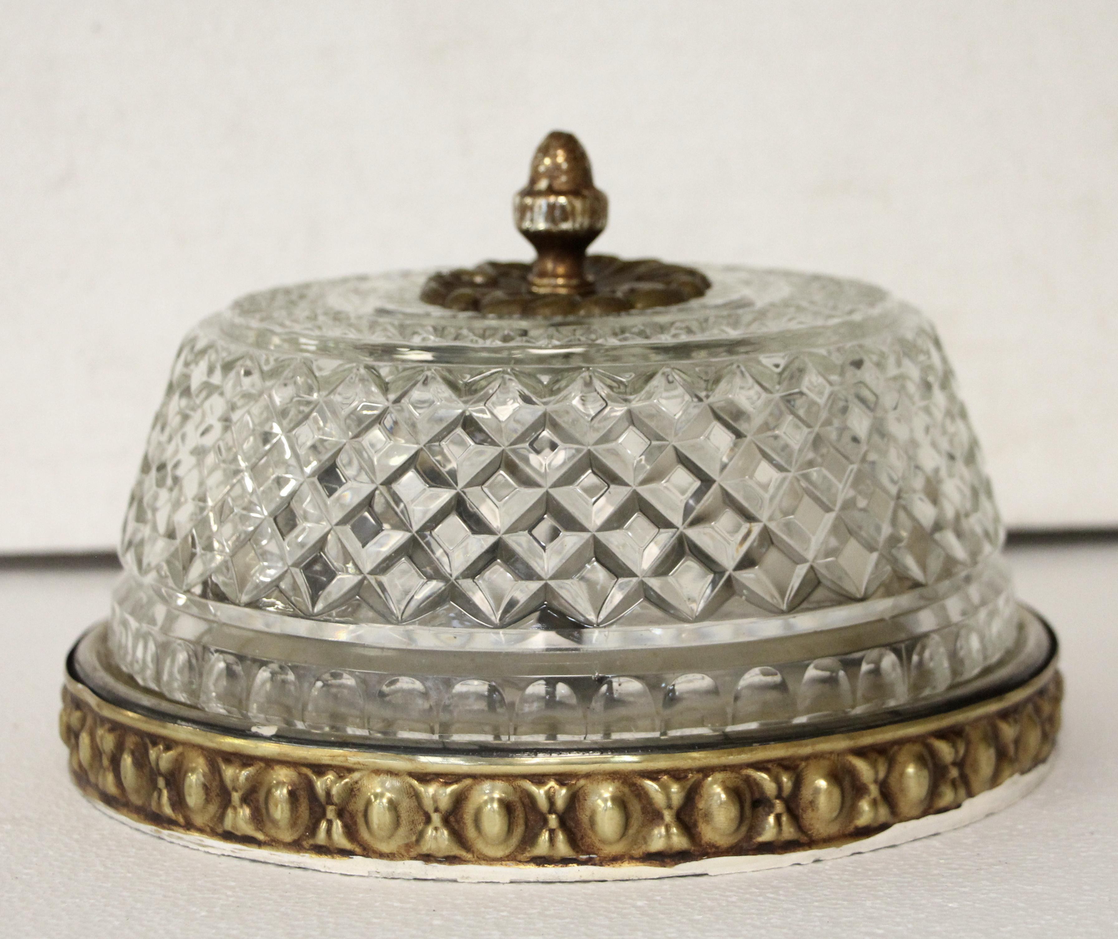 Crystal flush mount light fixture with a decorative brass base and a pineapple finial. Cleaned and restored. Price includes cleaning and rewiring. Waldorf Astoria authenticity card included with your purchase. Small quantity available at time of