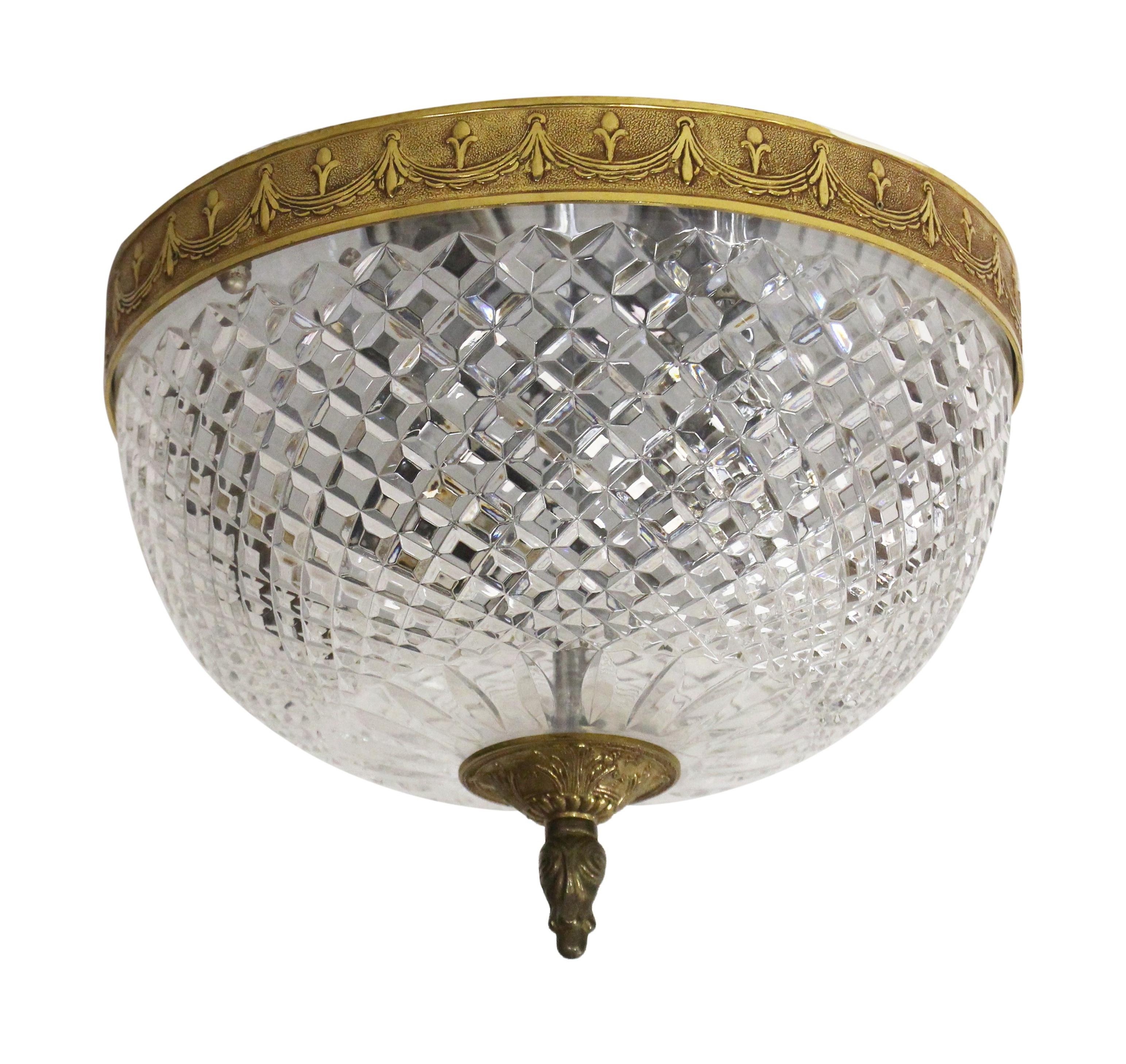 Clear crystal Italian flush mount light with a brass decorative rim and finial from the 1980s. Reclaimed from the corridors of the Towers of NYC Waldorf Astoria Hotel. A Waldorf Astoria authenticity card included with your purchase. Small quantity