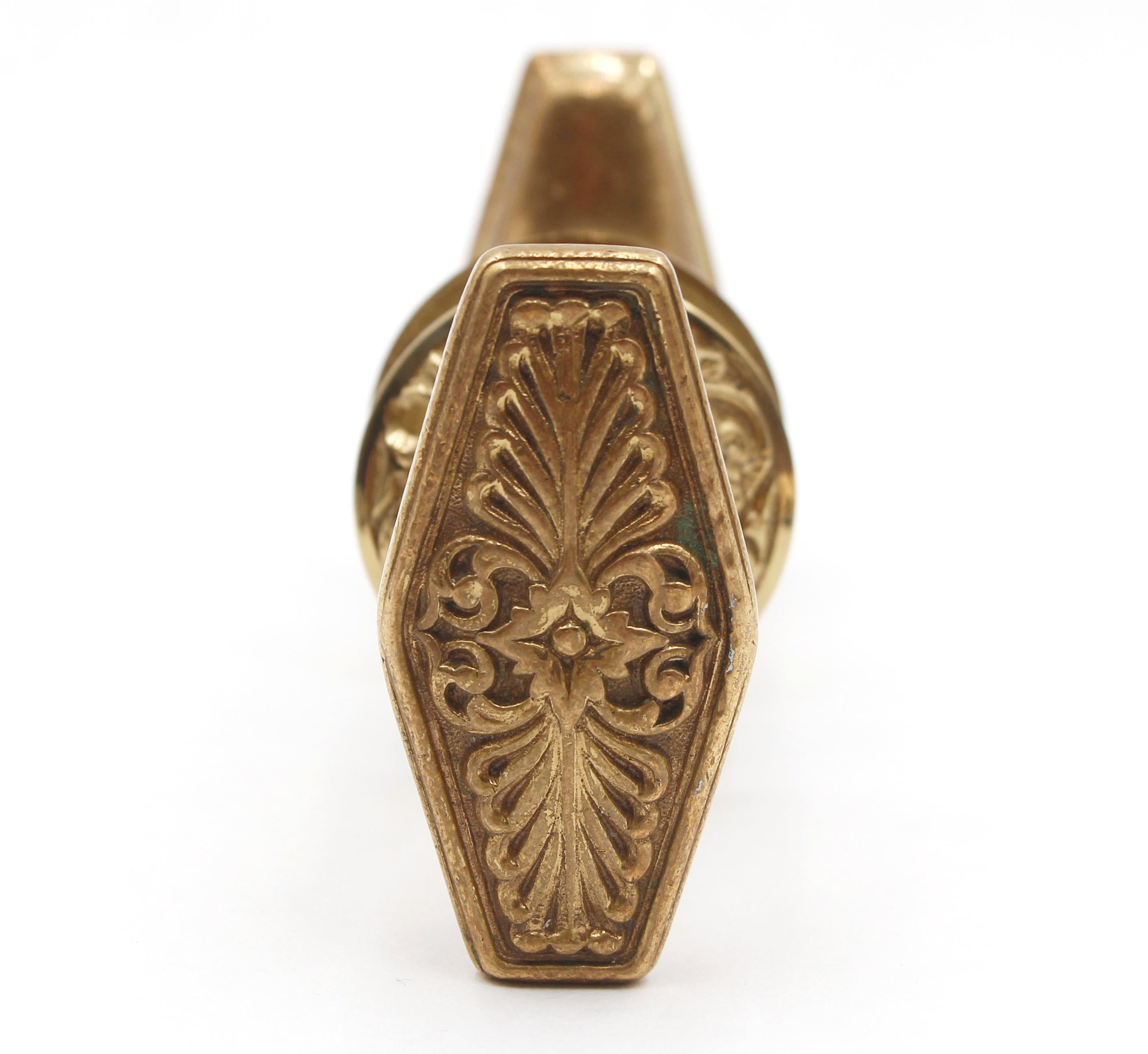 The Waldorf Astoria doorknobs are a piece of historical and luxurious hardware. These two-fold oval bronze doorknobs were crafted by Russell & Erwin and featured in the 1931 catalog as part of the N-10400 group. They were designed specifically for