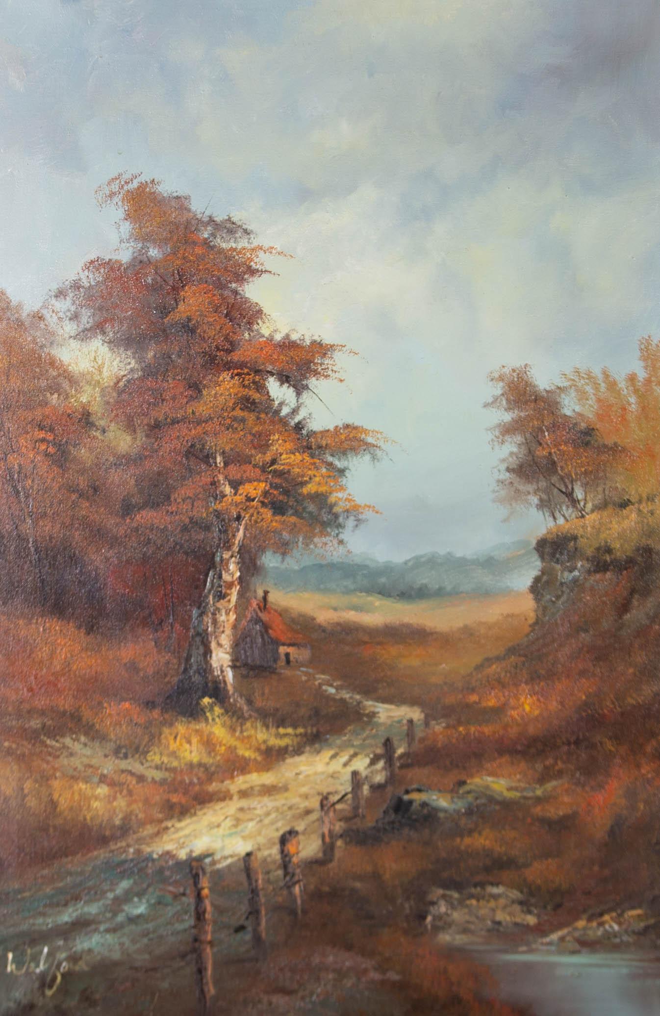 An autumnal scene in the countryside featuring a path leading towards a small hut in the middle distance. Presented in a gilt-effect wooden frame with an ornate edge. Signed to the lower-left corner. On canvas on stretchers.