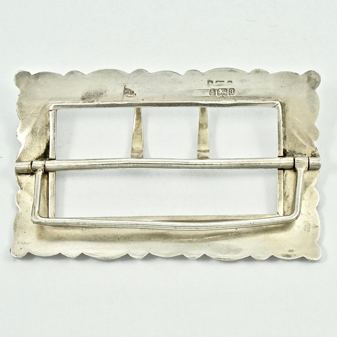 Walker & Hall antique Victorian sterling silver buckle, with lovely floral edging decoration. Measuring  7.6 cm / 3 inches by 4.7 cm / 1.85 inches. The buckle is stamped with an anchor, a lion, and the date letter is 'a'. The makers mark is for