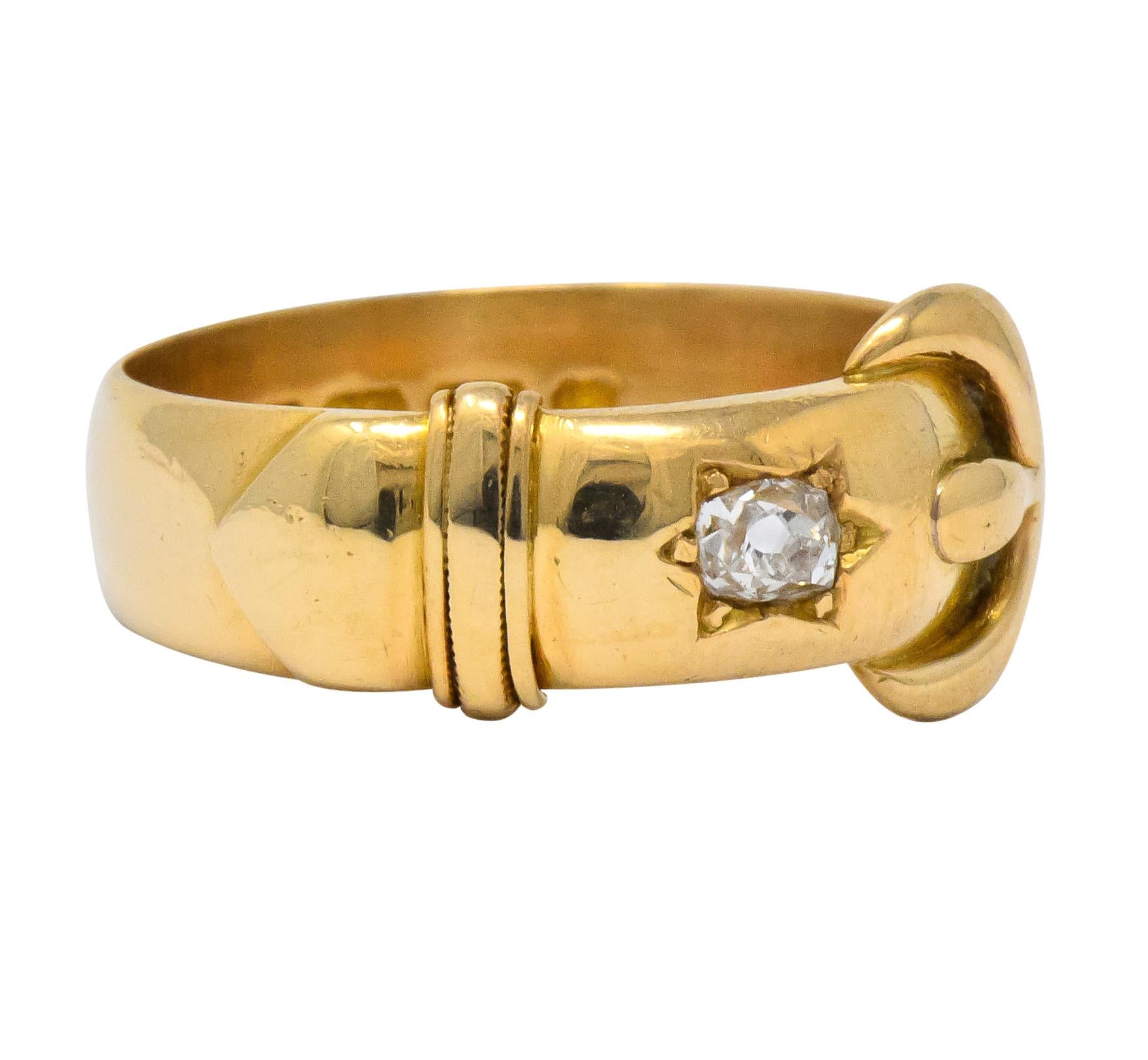 Band style ring designed as polished gold buckle

Centering a star set old mine cut diamond weighing approximately 0.18 carat, H color and SI1 clarity

Stamped 18 with maker's mark for Walker & Hall

British hallmarks for gold, 18 karat, Birmingham,