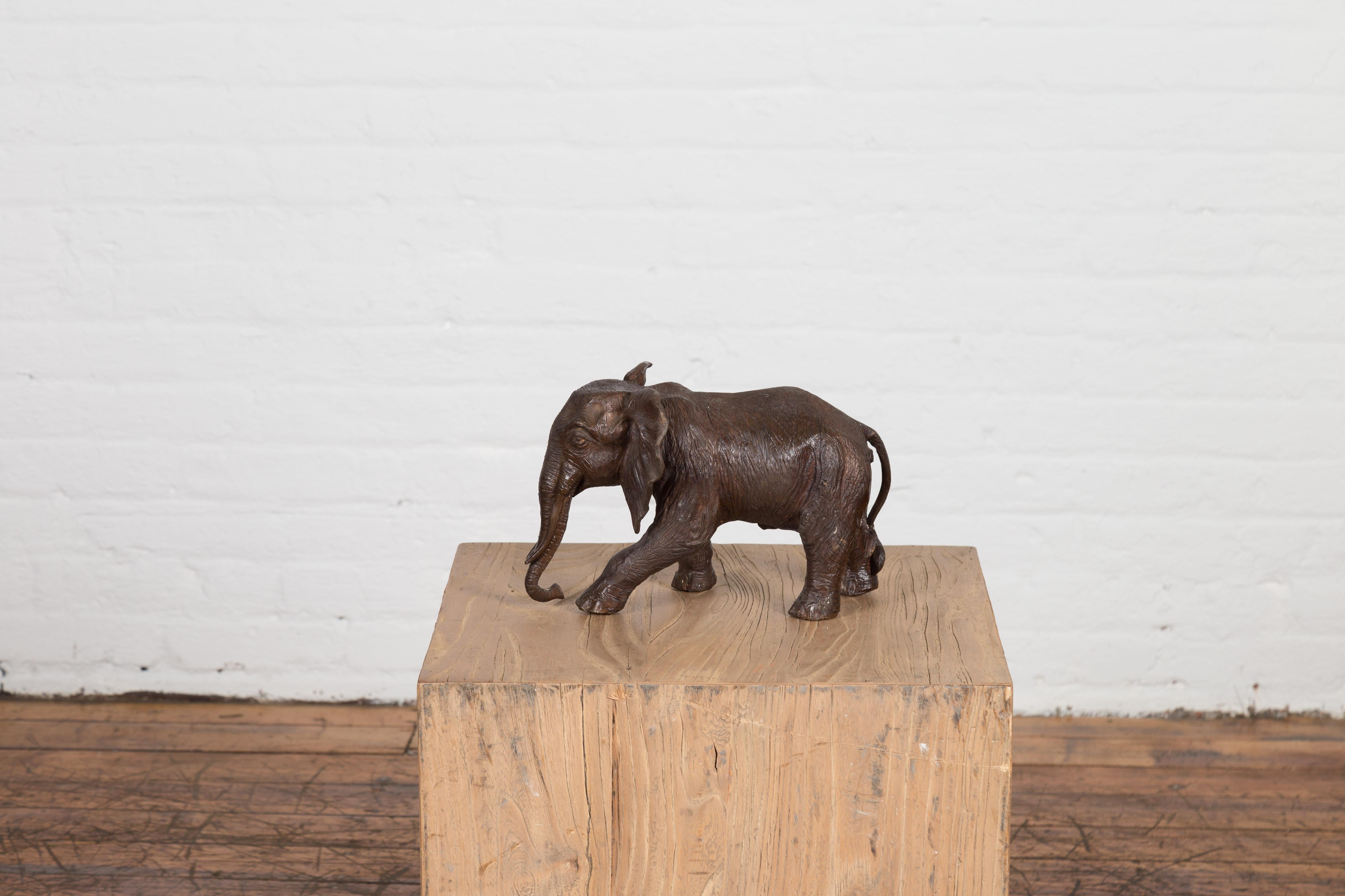20th Century Walking Baby Elephant Lost Wax Cast Bronze Tabletop Sculpture with Dark Patina For Sale