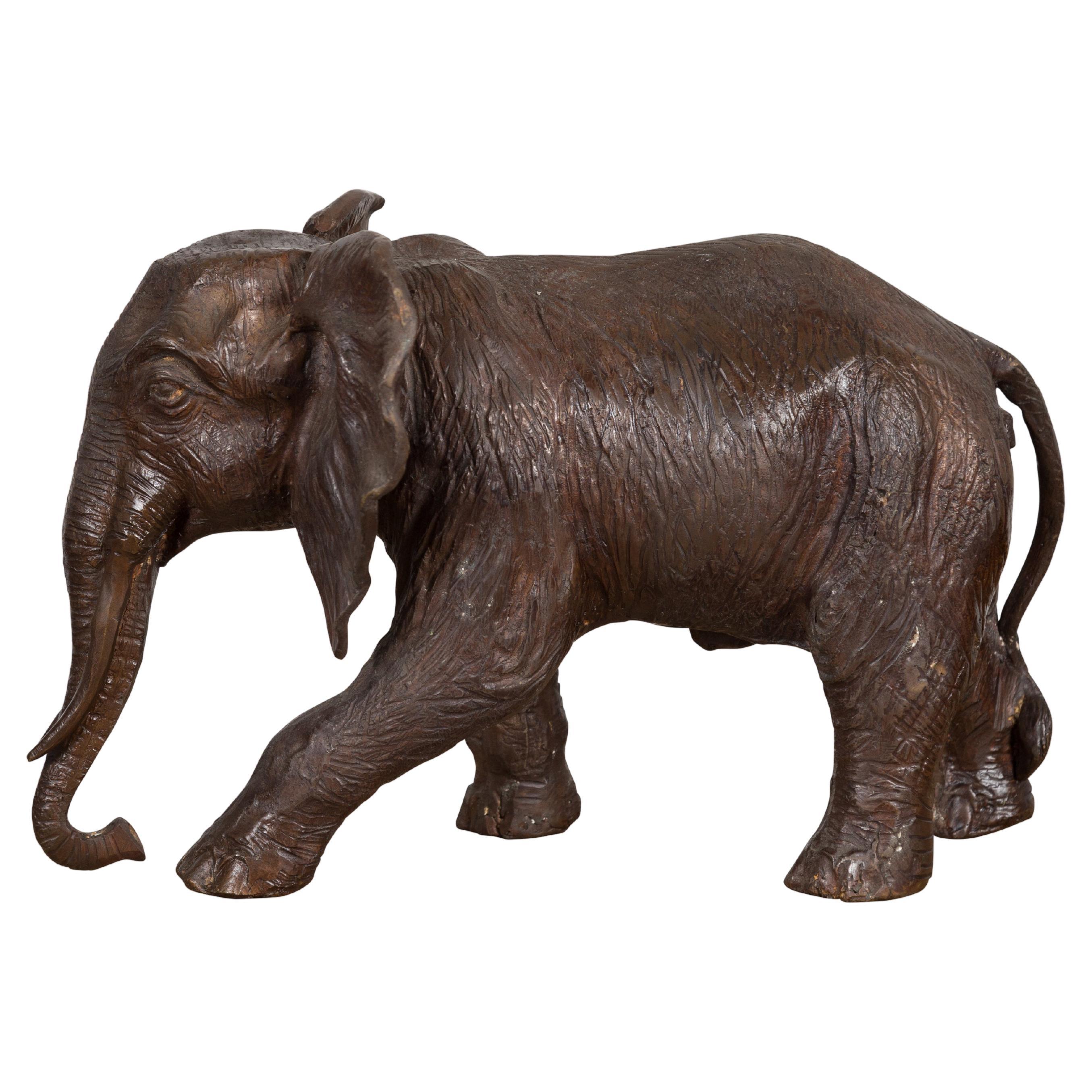 Walking Baby Elephant Lost Wax Cast Bronze Tabletop Sculpture with Dark Patina For Sale