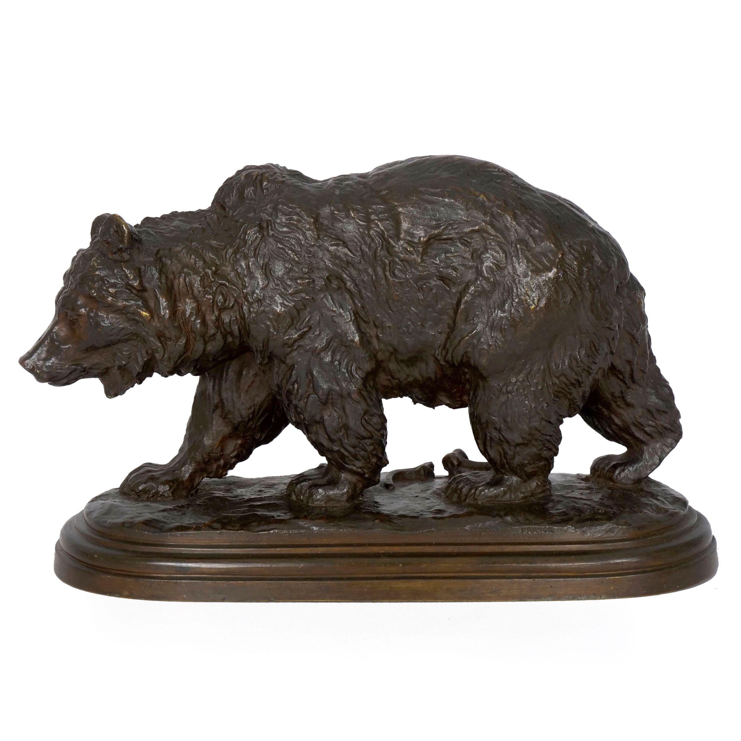 With a complex original patina with varying hues of brown, red-oxide and traces of black, this sculpture captures the slow movements of a sleepy bear as he trudges across a naturalistic base over scattered broken bones. It was cast by the Hippolyte