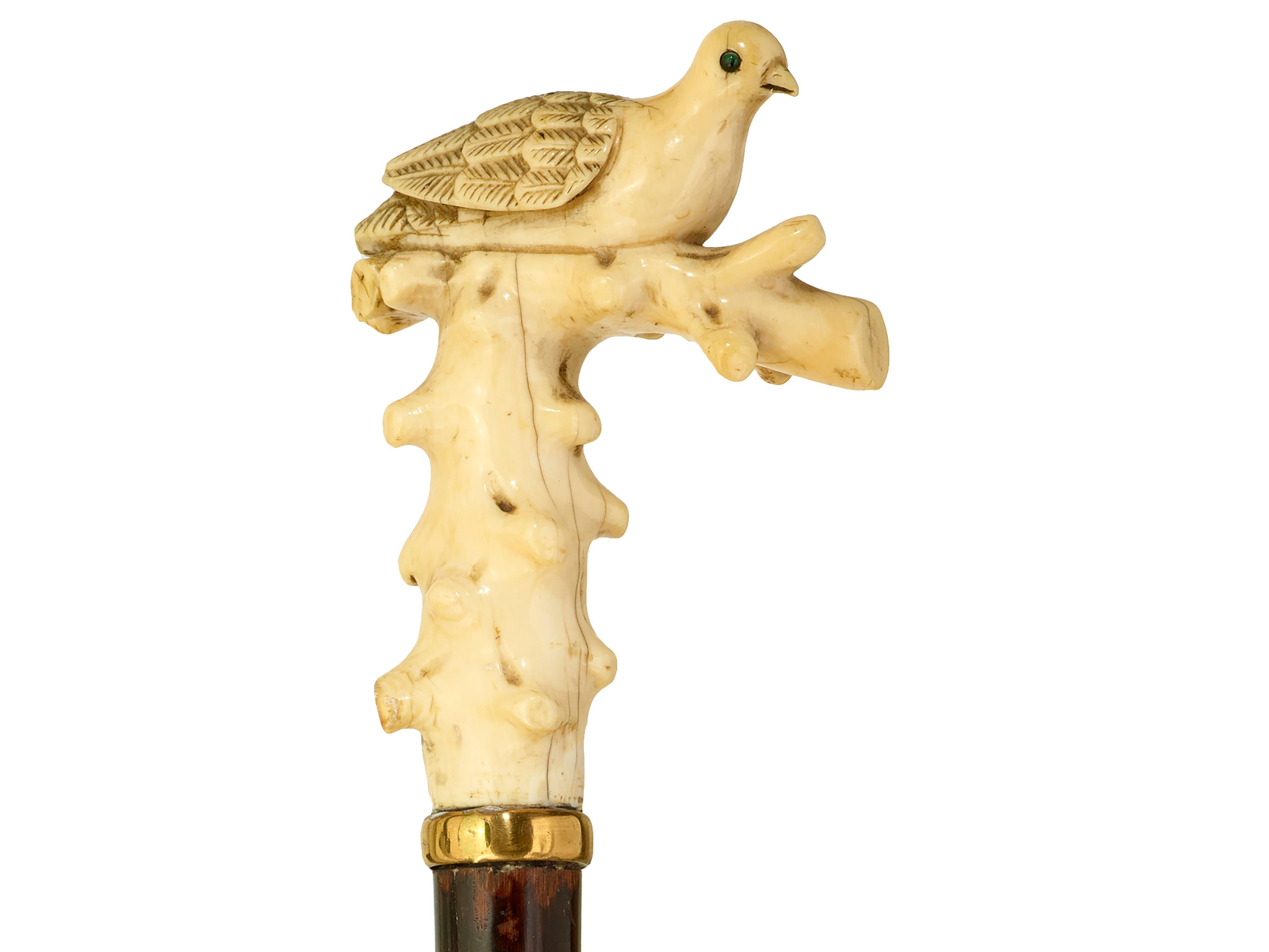 Walking cane carved dove
Carved dove on branch with green glass eyes, snakewood shaft. 
Will be supplied with Ivory Submission Reference No.
L 93cm, d 6.5cm, w 2.5cm. Circa 1880