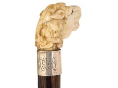 Walking cane with carved horse head