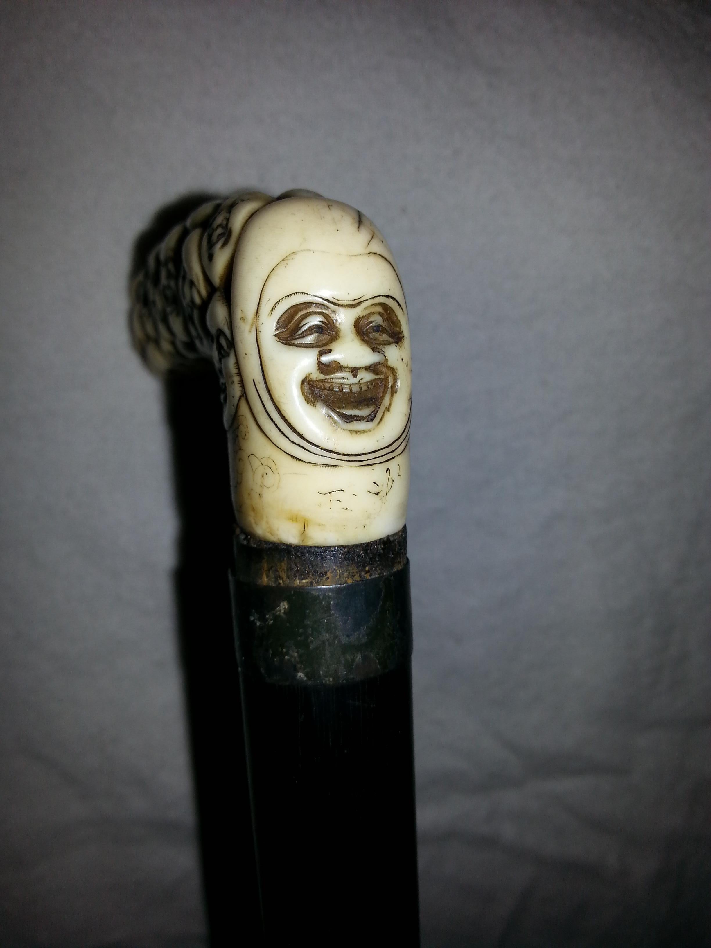 19th Century Walking Cane with Ivory Faces