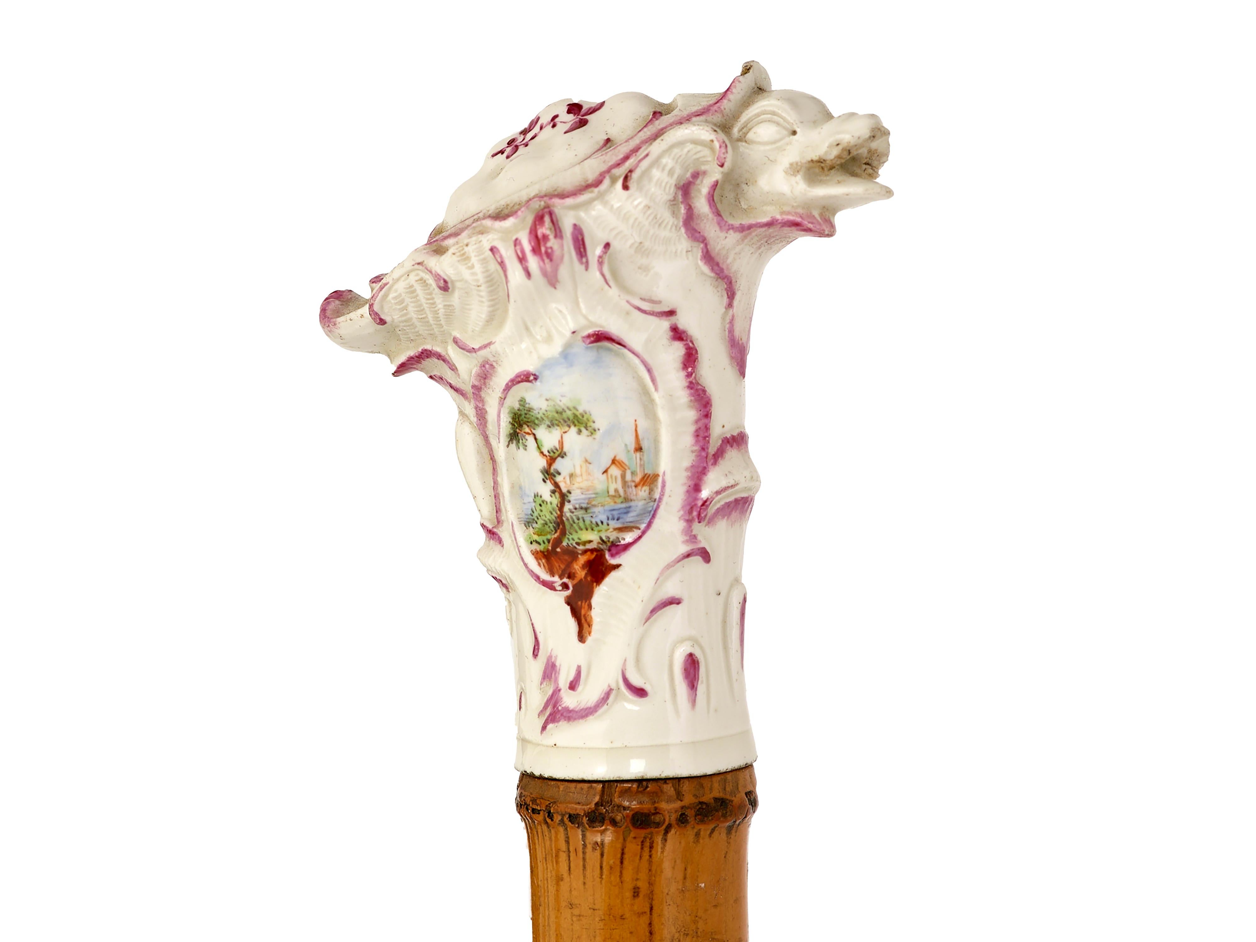 Turtle top walking cane
Meissen porcelain top depiction of a turtle, on original cane shaft with horn ferrule. Nautical views hand painted with magenta highlights. circa 1850. L 91, w 6. d 3. Germany
