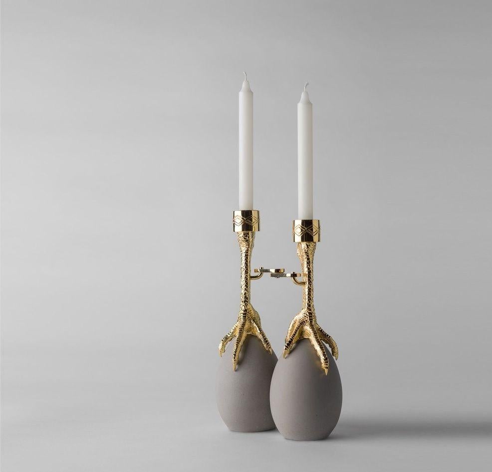 Walking Hen candleholder by Aisha Al Sowaidi
Limited Edition of 8 unique pieces + 2 prototype + 2 artist proof.
Dimensions: Diameter 21 x H 30 cm 
Materials: 24-carat gold plated cast brass claws and steel link. Cement eggs.


People shape