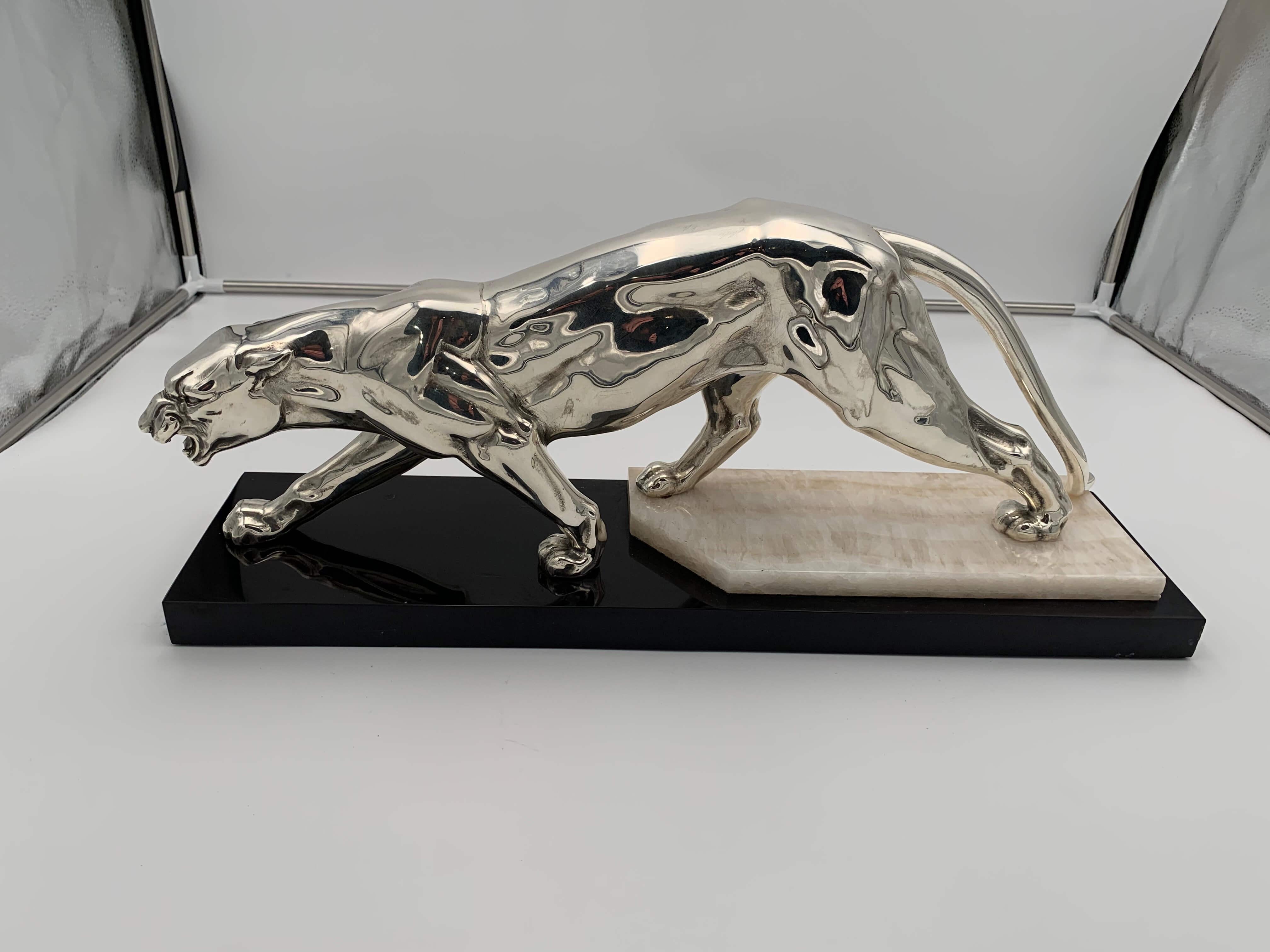 Walking Panther sculpture, silver-plate, marble, France circa 1930

Original Art Deco sculpture of a walking panther in the style of Rochard.

Art metal casting, silver-plated. Standing on marble plinth.
Design: probably Rochard (Irénée